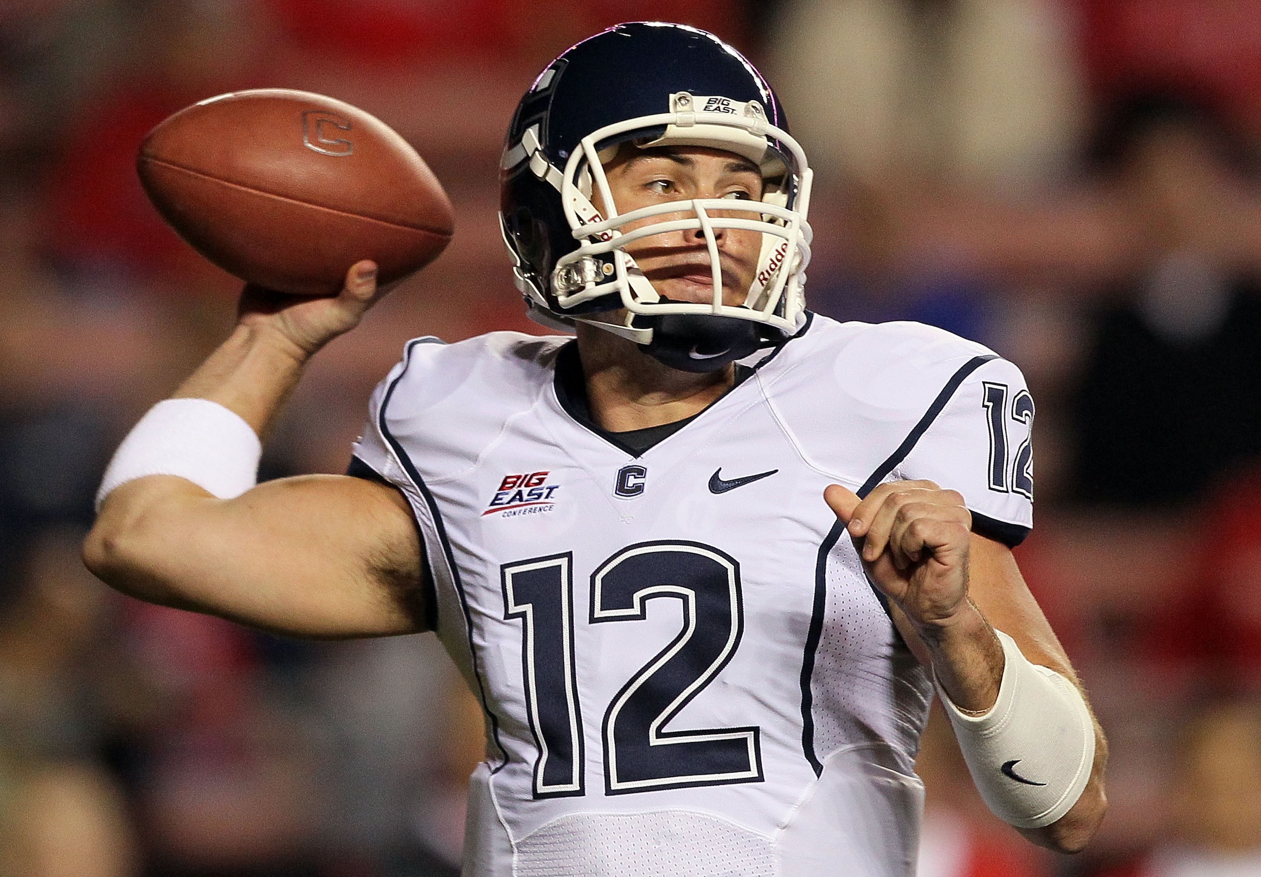 PISCATAWAY, NJ - OCTOBER 08:  Cody Endres #12 of the Connecticut Huskies throws a pass against the Rutgers Scarlet Knights at Rutgers Stadium on October 8, 2010 in Piscataway, New Jersey.  (Photo by Jim McIsaac/Getty Images)