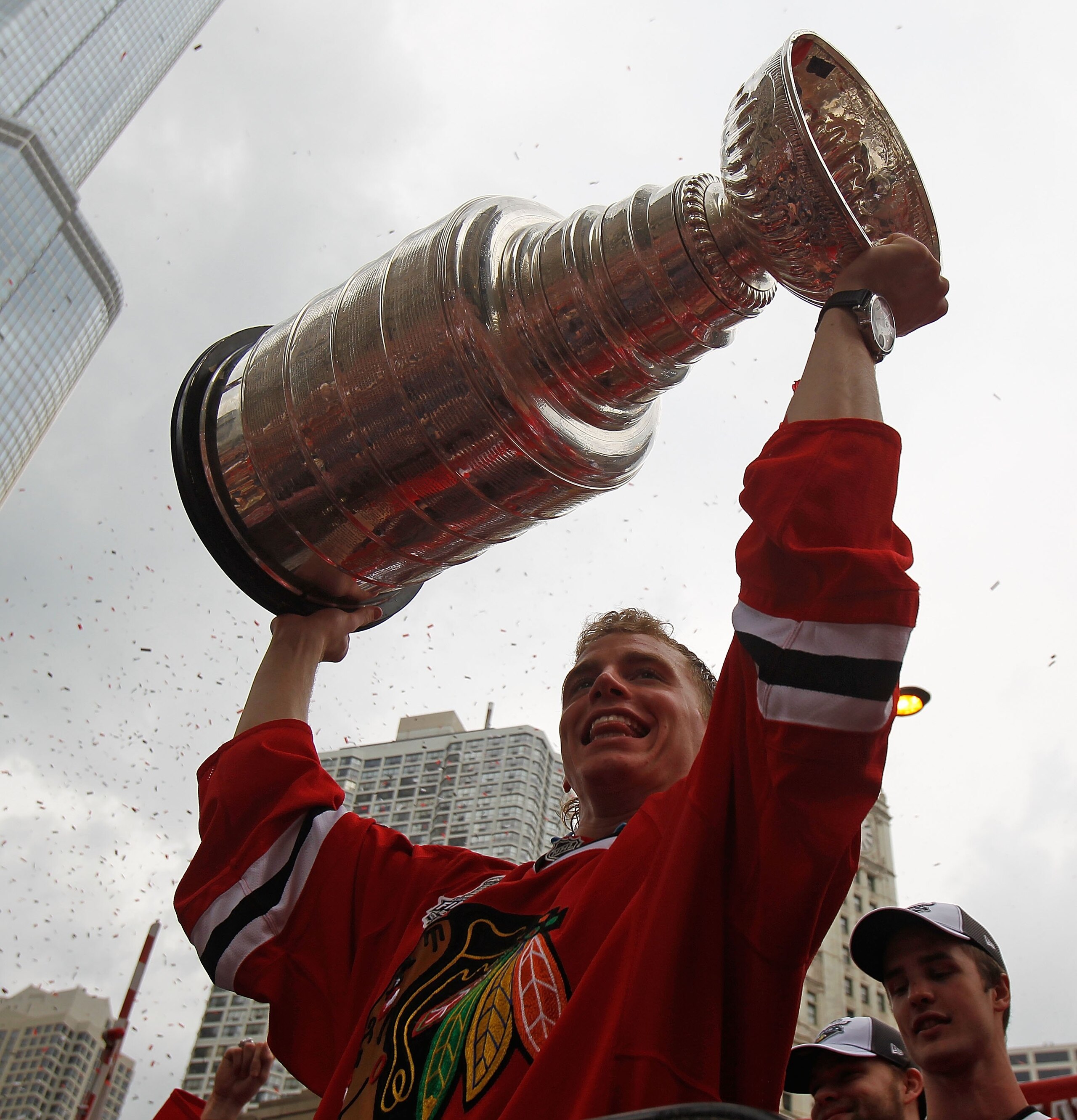 CHICAGO - JUNE 11: Patrick Kane #88 hoists the cup during the Chicago Blackhawks Stanley Cup victory parade and rally on June 11, 2010 in Chicago, Illinois. (Photo by Jonathan Daniel/Getty Images)