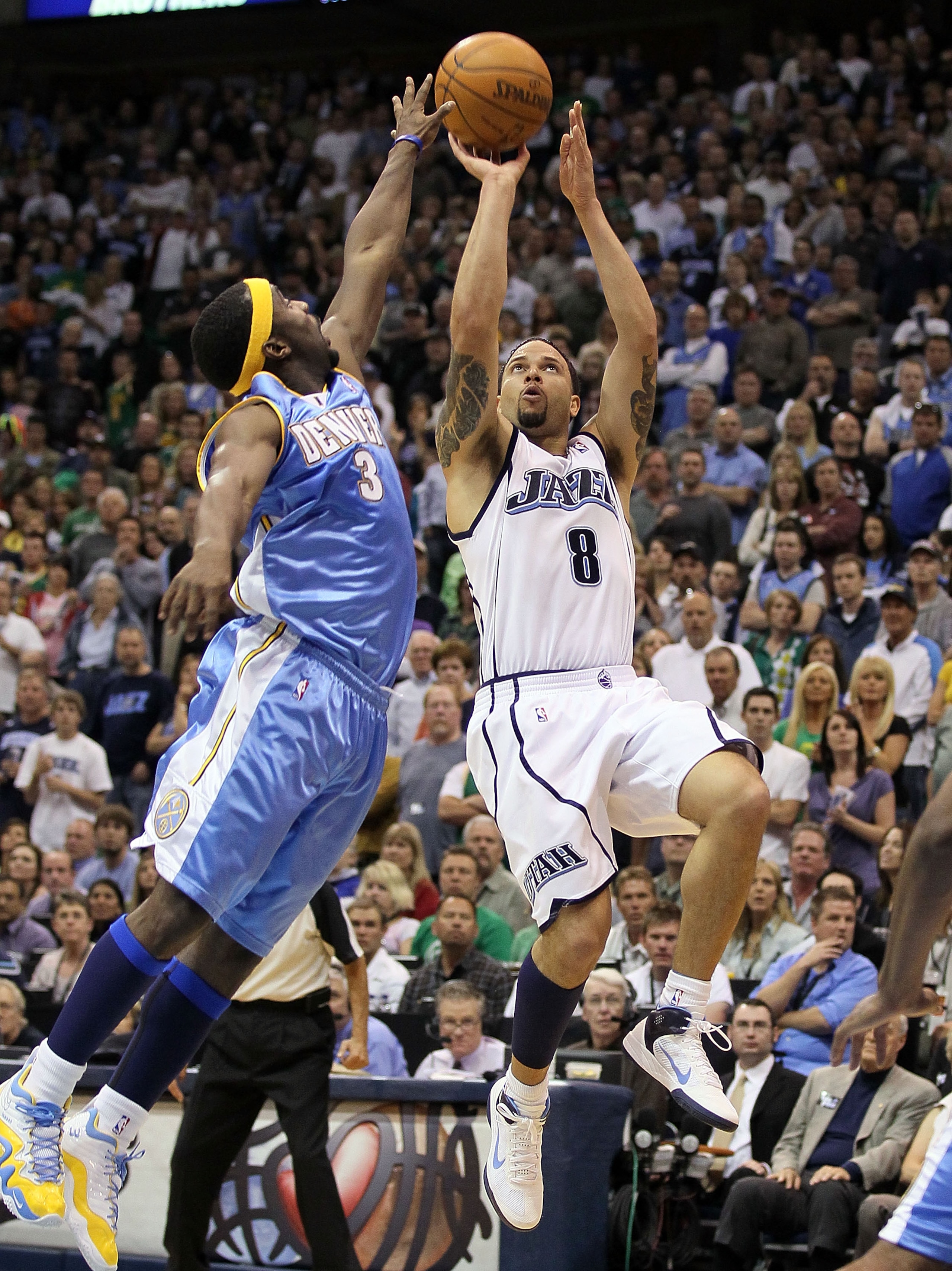 SALT LAKE CITY - APRIL 25: Deron Williams #8 of the Utah Jazz shoots the ball while defended by Ty Lawson #3 of the Denver Nuggets during Game Four of the Western Conference Quarterfinals of the 2010 NBA Playoffs at EnergySolutions Arena on April 25, 201 SALT LAKE CITY - APRIL 25: Deron Williams #8 of the Utah Jazz shoots the ball while defended by Ty Lawson #3 of the Denver Nuggets during Game Four of the Western Conference Quarterfinals of the 2010 NBA Playoffs at EnergySolutions Arena on April 25, 201