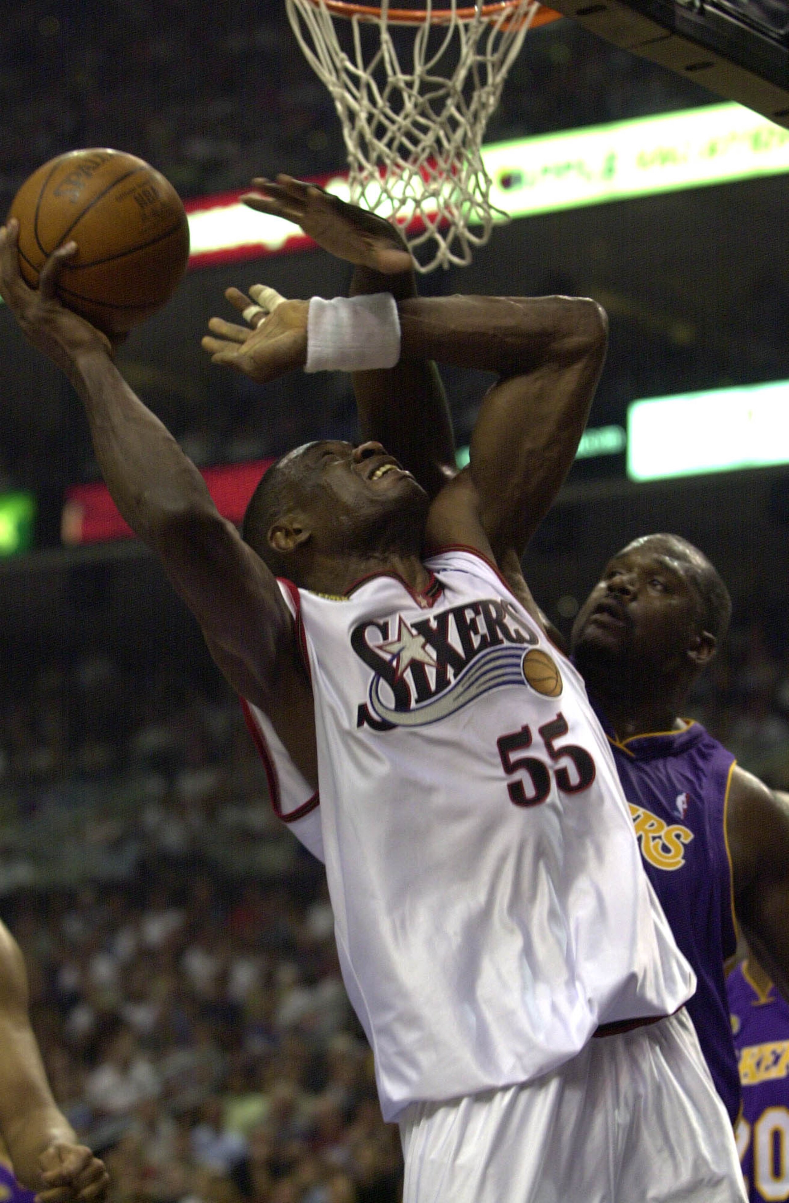 15 Jun 2001:  Dikembe Mutombo #55 of the Philadelphia 76ers puts a shot up against the defense of Shaquille O''Neal #34 of the Los Angeles Lakers in game five of the NBA Finals at the First Union Center in Philadelphia, Pennsylvania.  The Lakers won 108-8