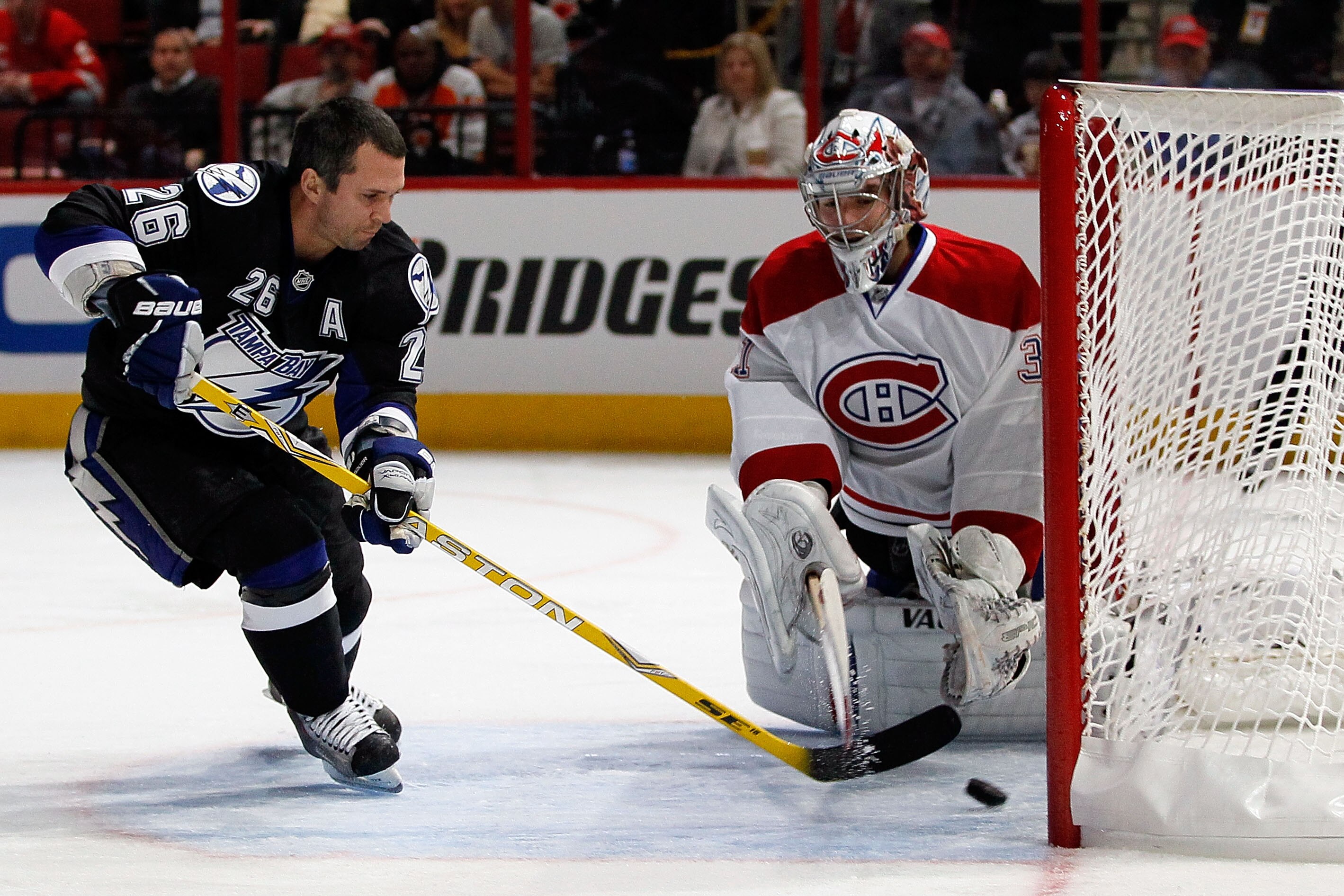 RALEIGH, NC - JANUARY 29:  Martin St. Louis #26 of the Tampa Bay Lightning shoots on Carey Price #31 of the Montreal Canadiens during the elimination shootout in the Honda NHL SuperSkills competition part of 2011 NHL All-Star Weekend at the RBC Center on