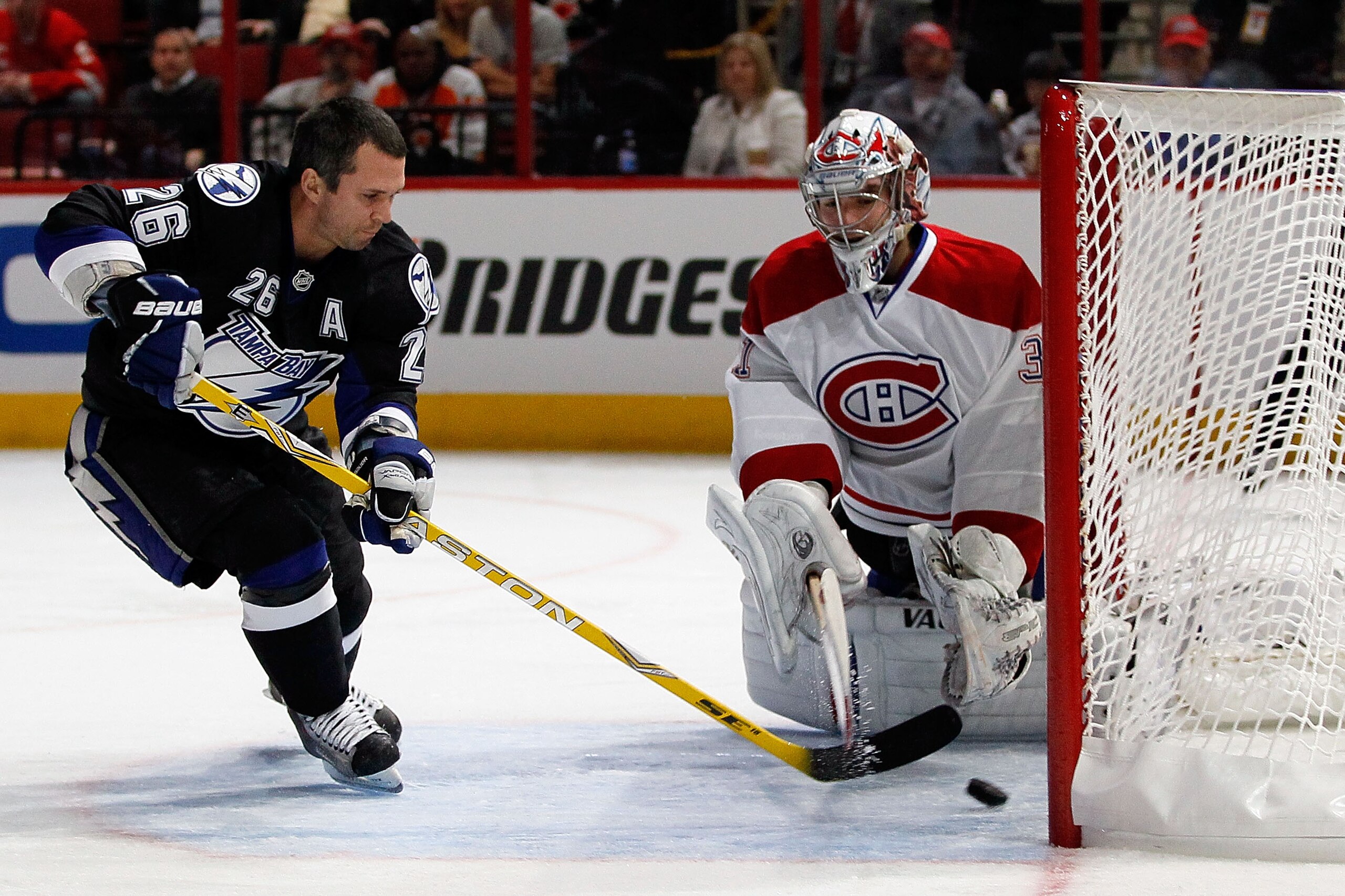 RALEIGH, NC - JANUARY 29: Martin St. Louis #26 of the Tampa Bay Lightning shoots on Carey Price #31 of the Montreal Canadiens during the elimination shootout in the Honda NHL SuperSkills competition part of 2011 NHL All-Star Weekend at the RBC Center on RALEIGH, NC - JANUARY 29: Martin St. Louis #26 of the Tampa Bay Lightning shoots on Carey Price #31 of the Montreal Canadiens during the elimination shootout in the Honda NHL SuperSkills competition part of 2011 NHL All-Star Weekend at the RBC Center on