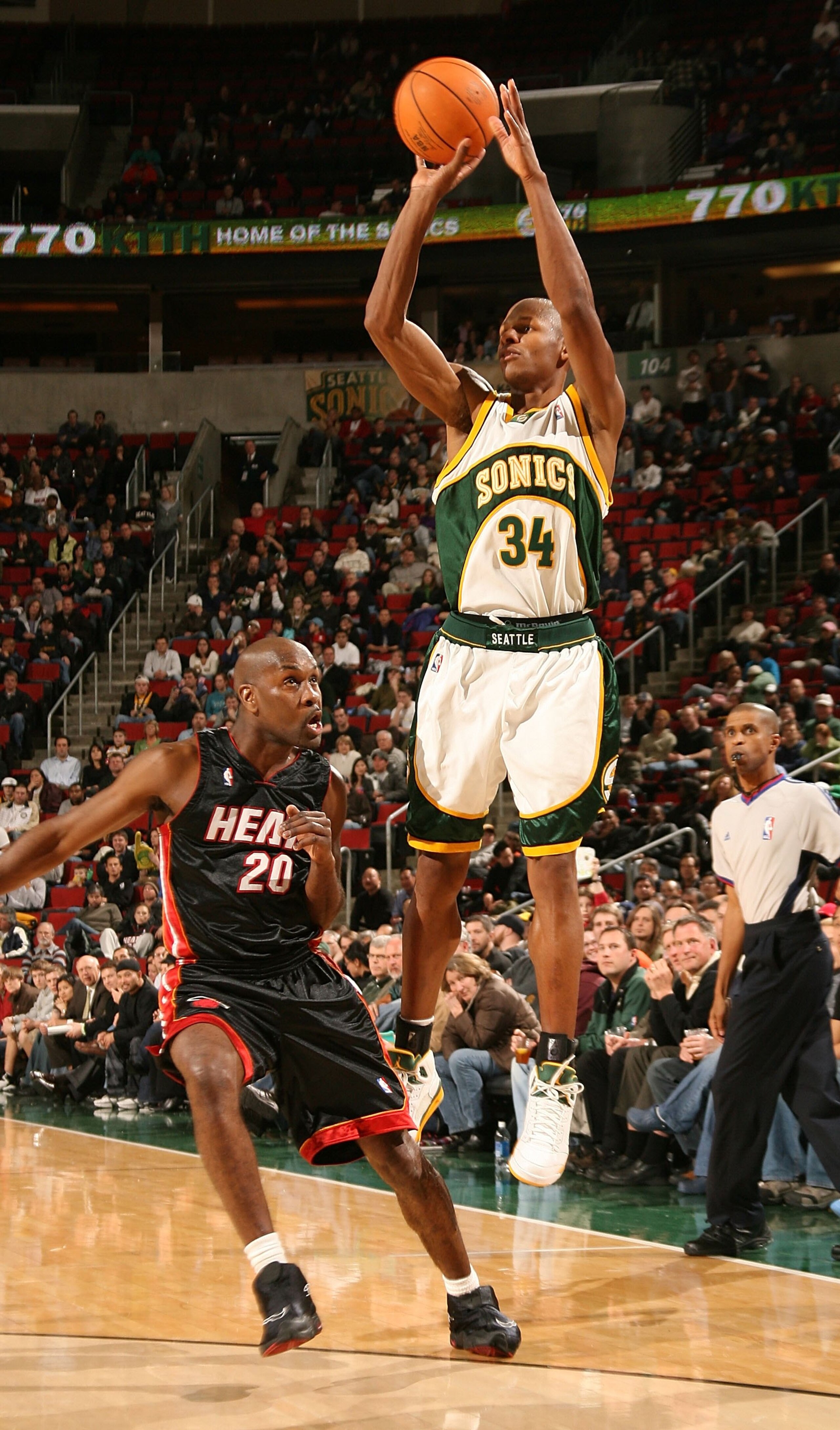 SEATTLE - JANUARY 10:  Ray Allen #34 of the Seattle SuperSonics shoots against Gary Payton #20 of the Miami Heat on January 10, 2007 at Key Arena in Seattle, Washington. NOTE TO USER: User expressly acknowledges and agrees that, by downloading and/or usin
