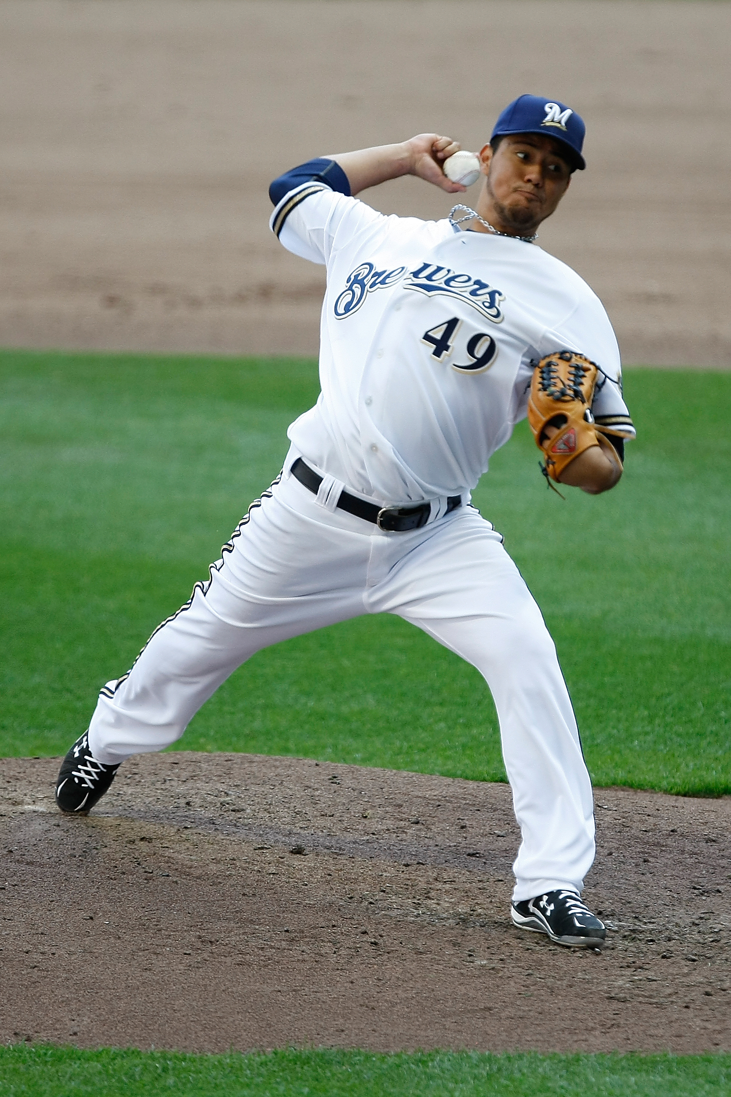 MILWAUKEE, WI - APRIL 05: Pitcher Yovani Gallardo #49 of the Milwaukee Brewers pitches the baseball against the Colorado Rockies at the Miller Park on April 05, 2010 in Milwaukee, Wisconsin. The Rockies defeated the Brewers 5-3.(Photo by Scott Boehm/Getty