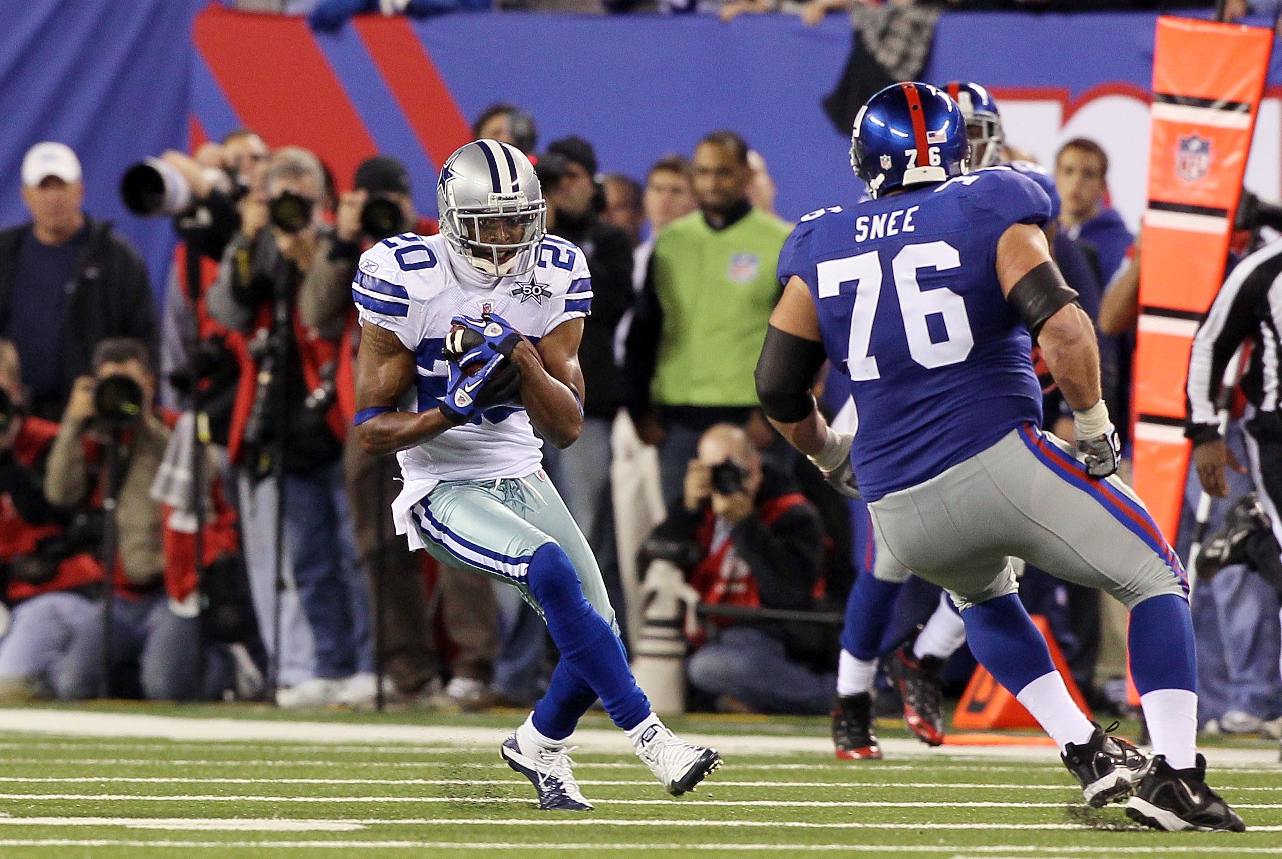 EAST RUTHERFORD, NJ - NOVEMBER 14: Alan Ball #20 of the Dallas Cowboys runs the ball against Chris Snee #76 of the New York Giants after an interception late in the fourth quartet on November 14, 2010 at the New Meadowlands Stadium in East Rutherford, New