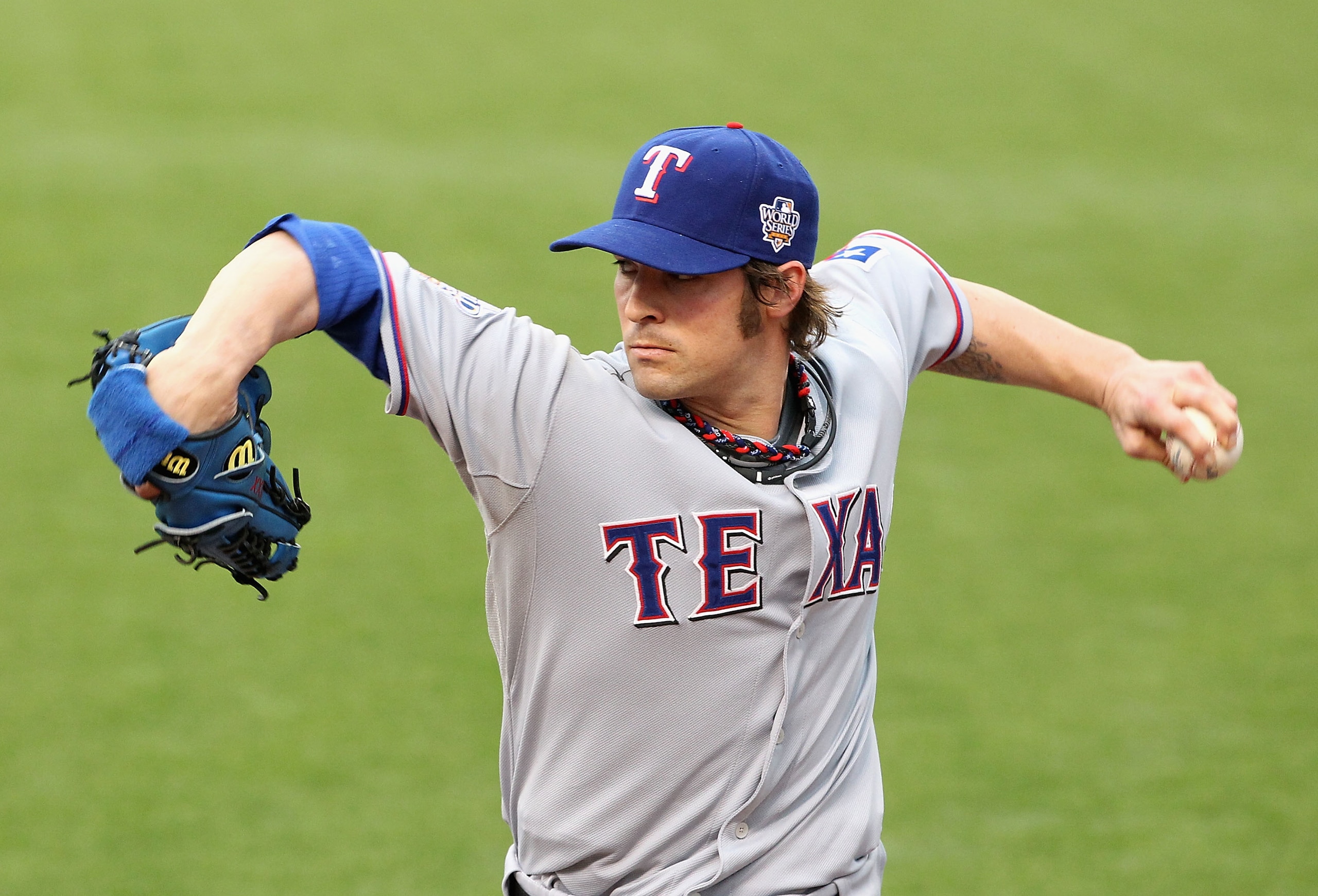 SAN FRANCISCO - OCTOBER 28: Starting pitcher C.J. Wilson #36 of the Texas Rangers warms up in the bullpen before taking on the San Francisco Giants in Game Two of the 2010 MLB World Series at AT&T Park on October 28, 2010 in San Francisco, California. ( SAN FRANCISCO - OCTOBER 28: Starting pitcher C.J. Wilson #36 of the Texas Rangers warms up in the bullpen before taking on the San Francisco Giants in Game Two of the 2010 MLB World Series at AT&T Park on October 28, 2010 in San Francisco, California. (