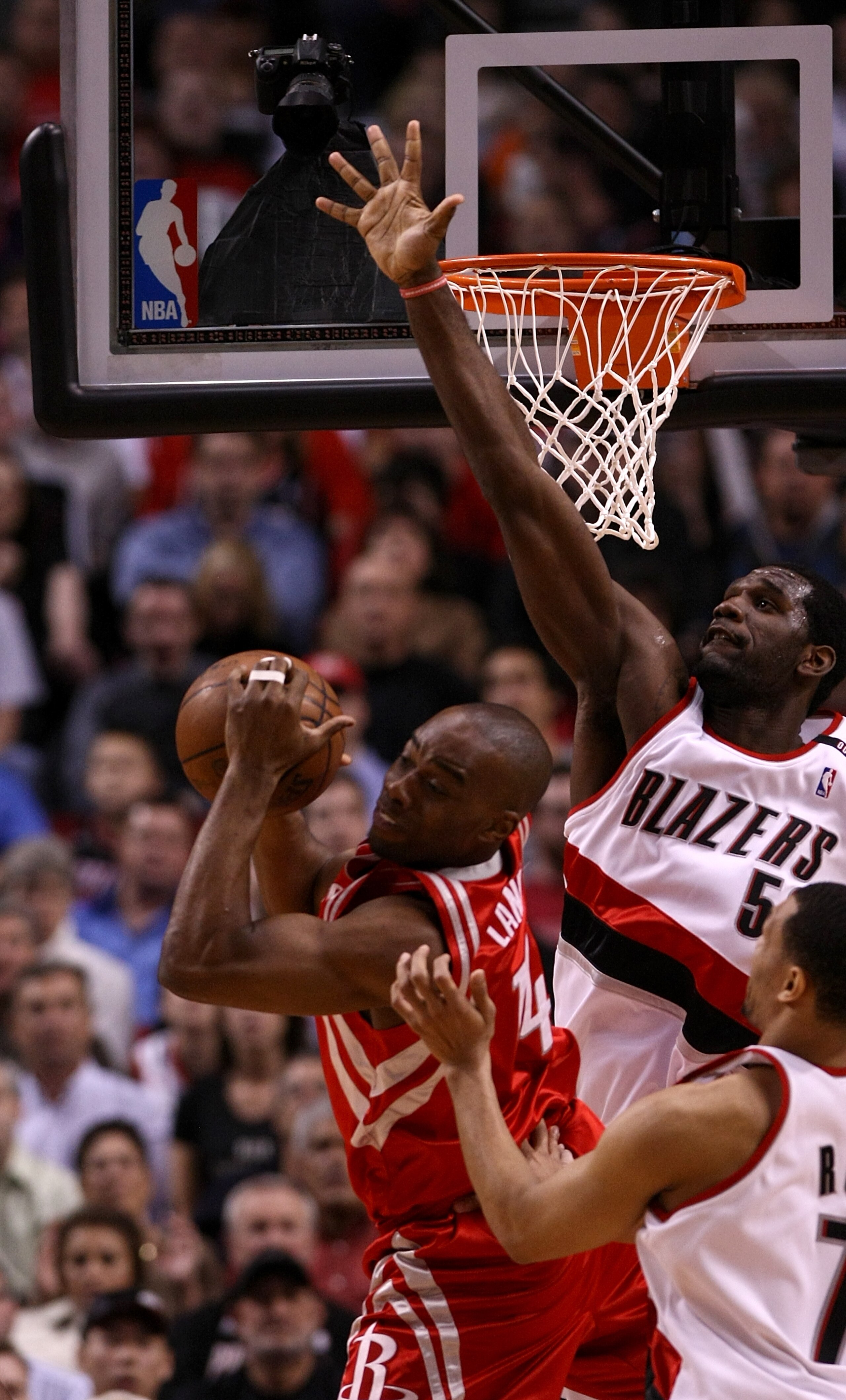 PORTLAND, OR - APRIL 28: Carl Landry #14 of the Houston Rockets is guarded by Greg Oden #52 of the Portland Trail Blazers during Game 5 of the Western Conference Quarterfinals of the NBA Playoffs on April 28, 2009 at the Rose Garden in Portland, Oregon. PORTLAND, OR - APRIL 28: Carl Landry #14 of the Houston Rockets is guarded by Greg Oden #52 of the Portland Trail Blazers during Game 5 of the Western Conference Quarterfinals of the NBA Playoffs on April 28, 2009 at the Rose Garden in Portland, Oregon.