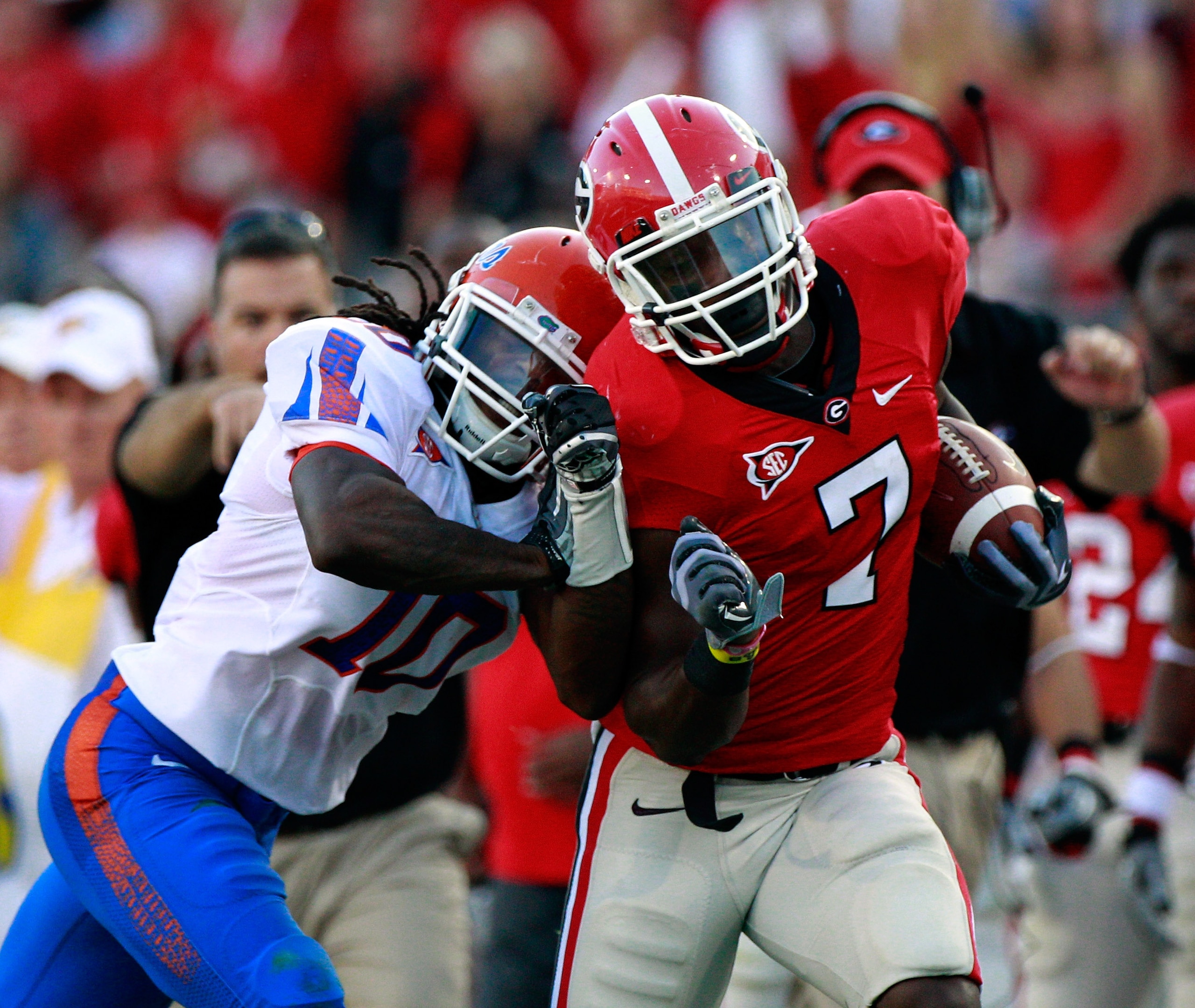 JACKSONVILLE, FL - OCTOBER 30:  Will Hill #10 of the Florida Gators attempts to tackle Orson Charles #7 of the Georgia Bulldogs during the game at EverBank Field on October 30, 2010 in Jacksonville, Florida.  (Photo by Sam Greenwood/Getty Images)