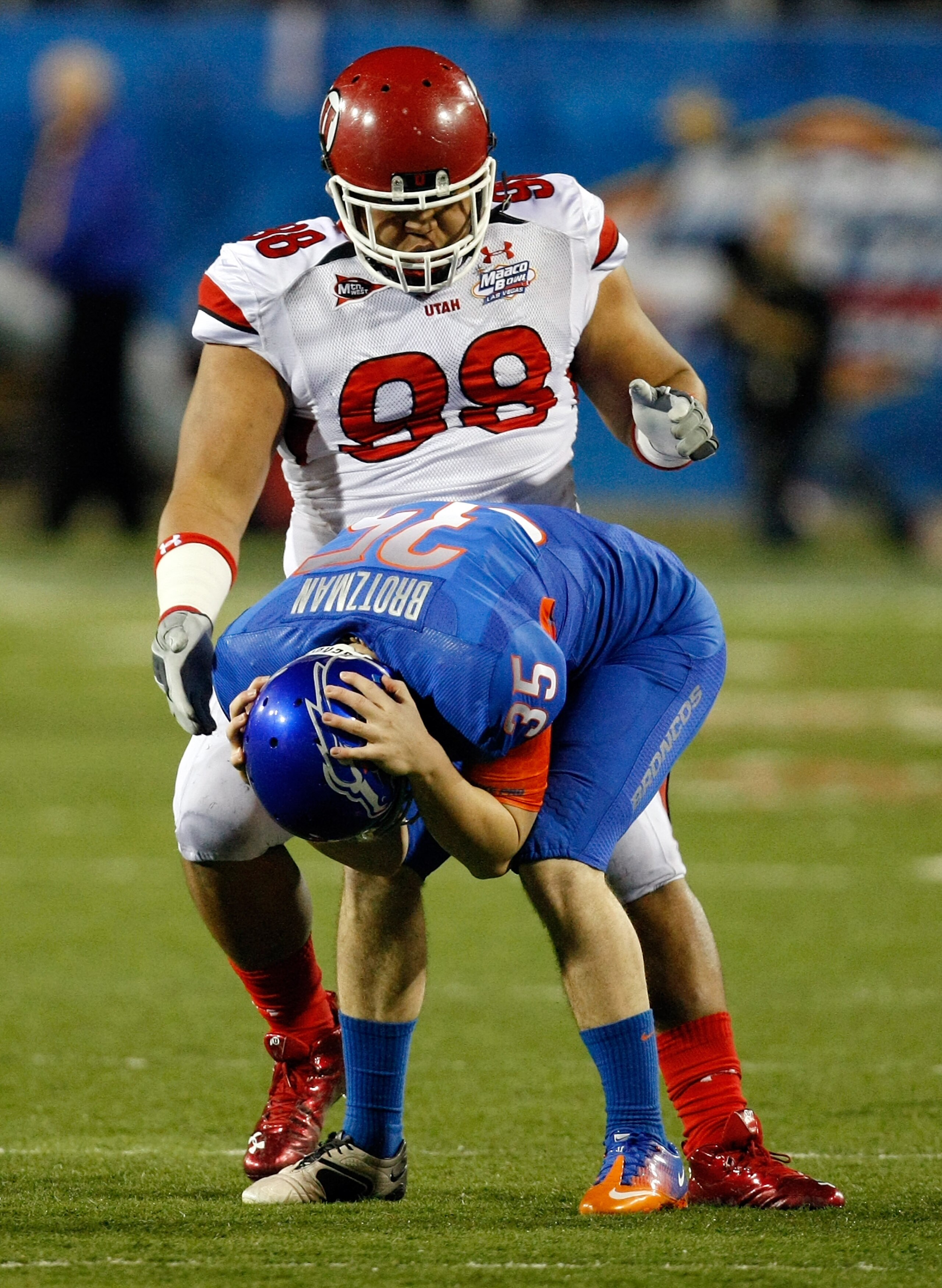 LAS VEGAS, NV - DECEMBER 22:  Kyle Brotzman #35 of the Boise State Broncos reacts in front of Sealver Siliga #98 of the Utah Utes after Brotzman dropped a pass intended for him on a fake punt during the MAACO Bowl Las Vegas at Sam Boyd Stadium December 22