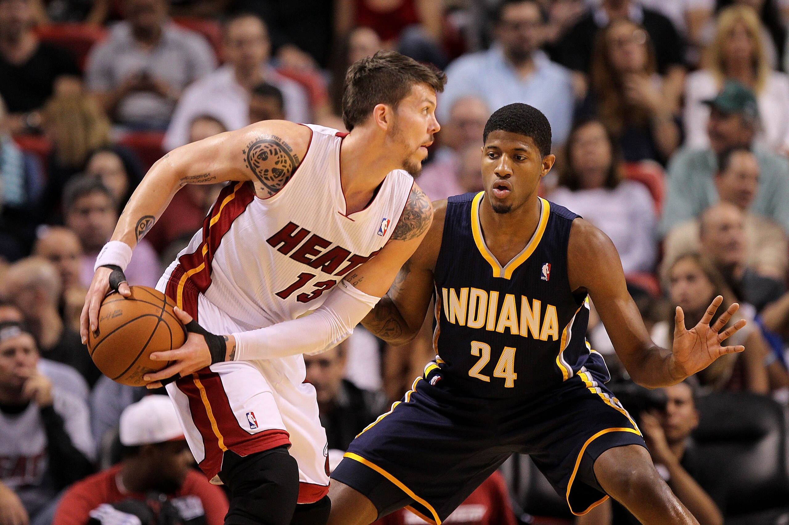 MIAMI, FL - FEBRUARY 08:  Mike Miller #13 of the Miami Heat posts up Paul George #24 of the Indiana Pacers during a game at American Airlines Arena on February 8, 2011 in Miami, Florida. NOTE TO USER: User expressly acknowledges and agrees that, by downlo