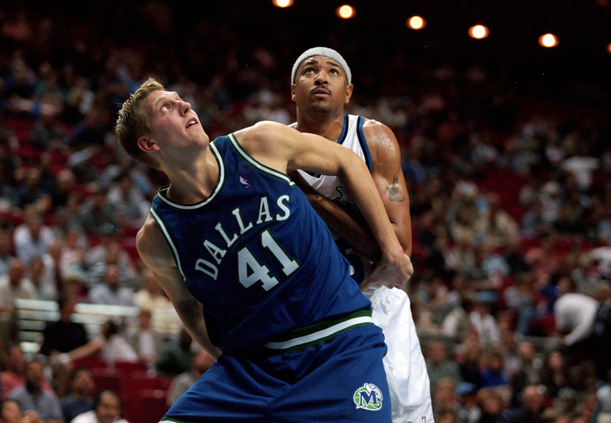 25 Oct 1999:  Dirk Nowitzui #14 of the Dallas Mavericks blocks Chris Gatling #25 of the Orlando Magic during the game at the Orlando Arena in Orlando, Florida. The Magic defeated the Mavericks 109-97.     Mandatory Credit: Andy Lyons  /Allsport