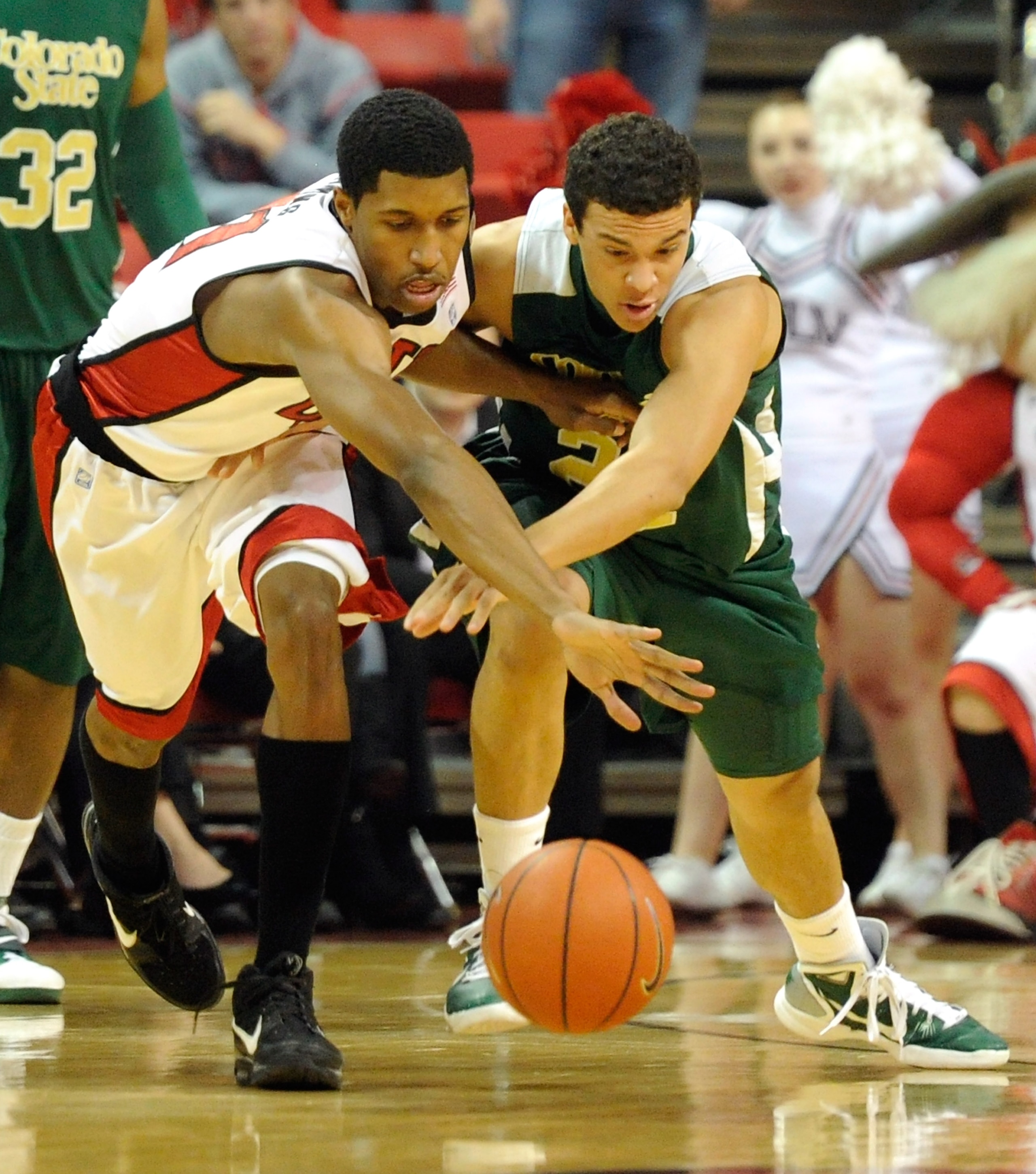 LAS VEGAS, NV - JANUARY 19:  Justin Hawkins #31 of the UNLV Rebels tries to steal the ball from Dorian Green #22 of the Colorado State Rams during their game at the Thomas & Mack Center January 19, 2011 in Las Vegas, Nevada.  (Photo by Ethan Miller/Getty