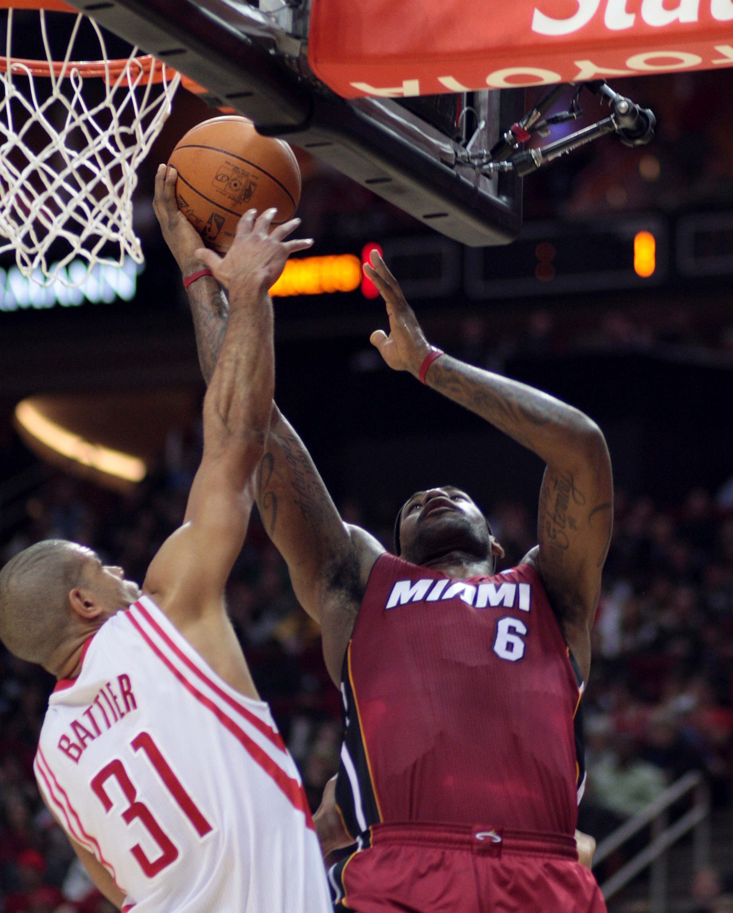 HOUSTON - DECEMBER 29:  LeBron James #6 of the Miami Heat drives to the basket over Houston Rockets' Shane Battier #31 in the first half at Toyota Center on December 29, 2010 in Houston, Texas.  NOTE TO USER: User expressly acknowledges and agrees that, b