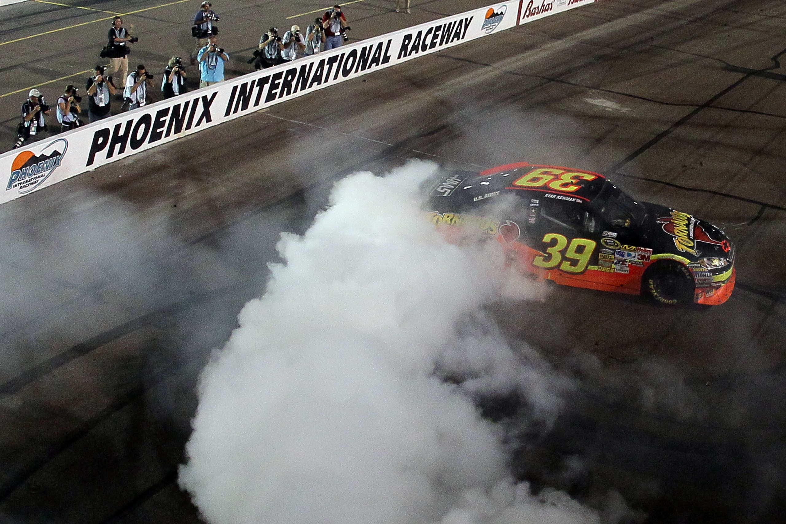 PHOENIX - APRIL 10:  Ryan Newman, driver of the #39 Tornados Chevrolet, celebrates with a burn out after winning the NASCAR Sprint Cup Series SUBWAY Fresh Fit 600 at Phoenix International Raceway on April 10, 2010 in Phoenix, Arizona.  (Photo by Jeff Gros