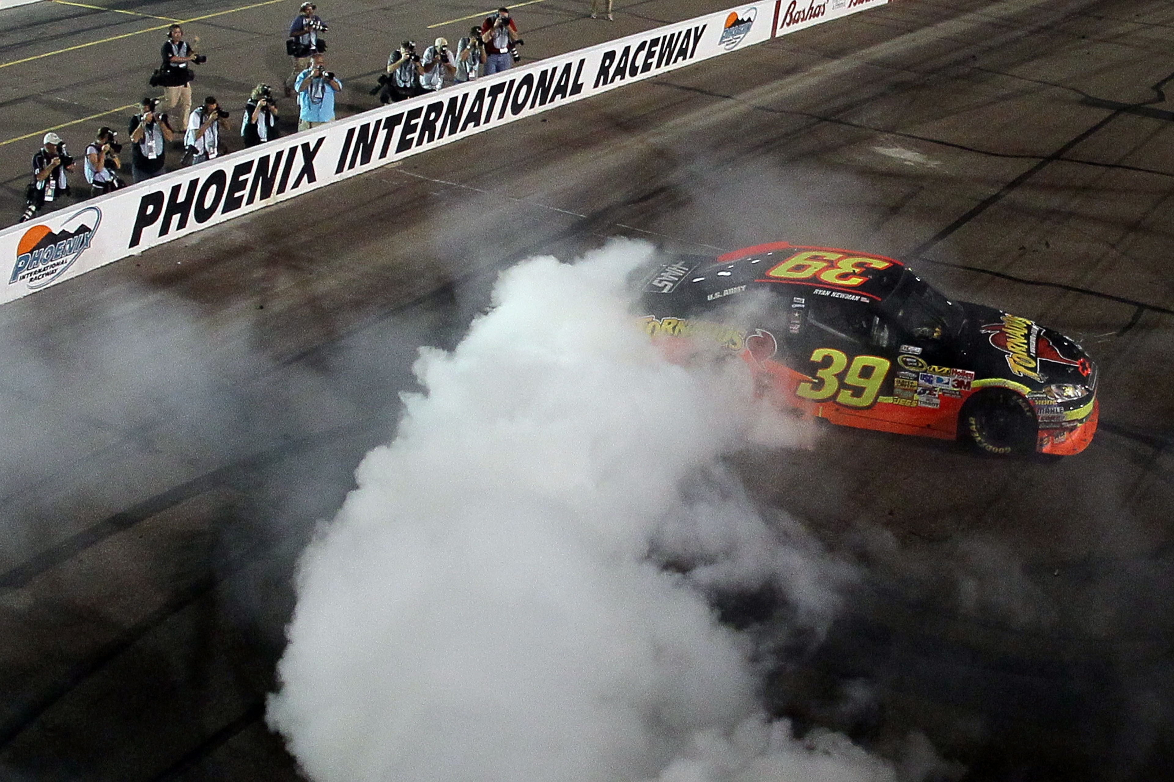 PHOENIX - APRIL 10:  Ryan Newman, driver of the #39 Tornados Chevrolet, celebrates with a burn out after winning the NASCAR Sprint Cup Series SUBWAY Fresh Fit 600 at Phoenix International Raceway on April 10, 2010 in Phoenix, Arizona.  (Photo by Jeff Gros