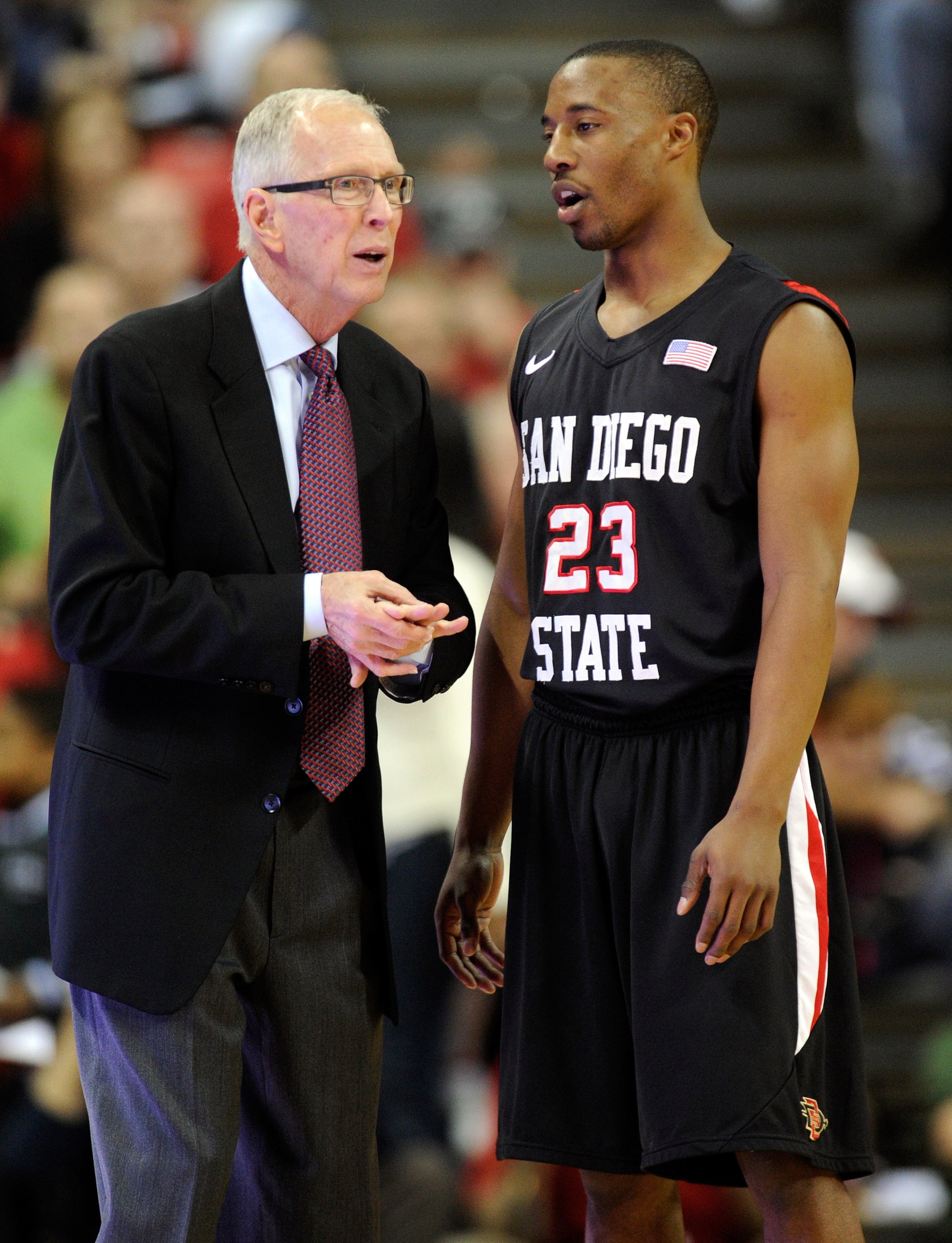 LAS VEGAS, NV - FEBRUARY 12:  Head coach Steve Fisher of the San Diego State Aztecs talks to D.J. Gay #23 during the team's game against the UNLV Rebels at the Thomas & Mack Center February 12, 2011 in Las Vegas, Nevada. San Diego State won 63-57.  (Photo
