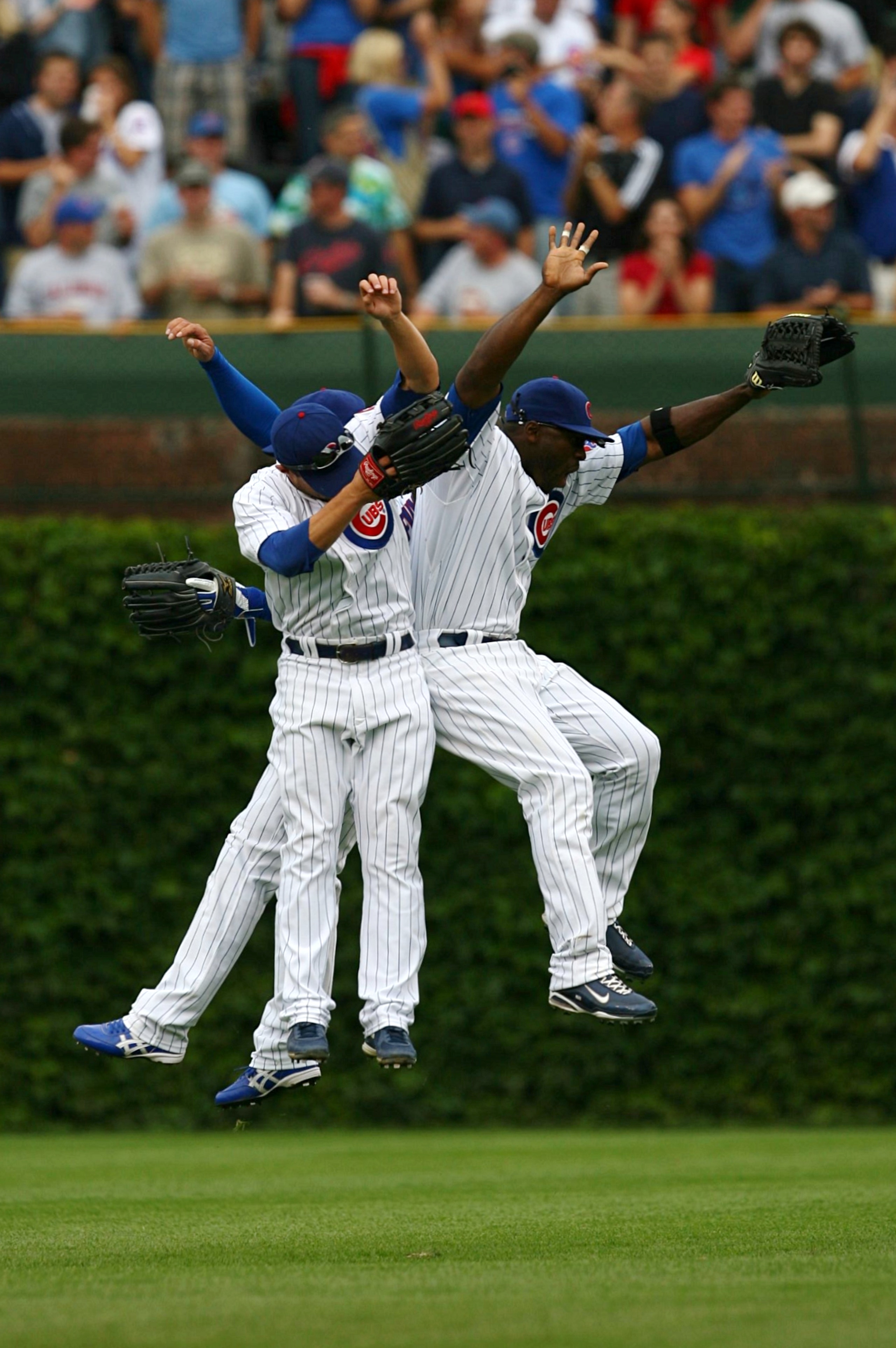 CHICAGO - AUGUST 28: (R-L) Chicago Cubs outfielders Milton Bradley #21, Sam Fuld #27 and Kosuke Fukudome #1 celebrate their 5-2 win over the New York Mets at Wrigley Field on August 28, 2009 in Chicago, Illinois. (Photo by Jonathan Daniel/Getty Images) CHICAGO - AUGUST 28: (R-L) Chicago Cubs outfielders Milton Bradley #21, Sam Fuld #27 and Kosuke Fukudome #1 celebrate their 5-2 win over the New York Mets at Wrigley Field on August 28, 2009 in Chicago, Illinois. (Photo by Jonathan Daniel/Getty Images)