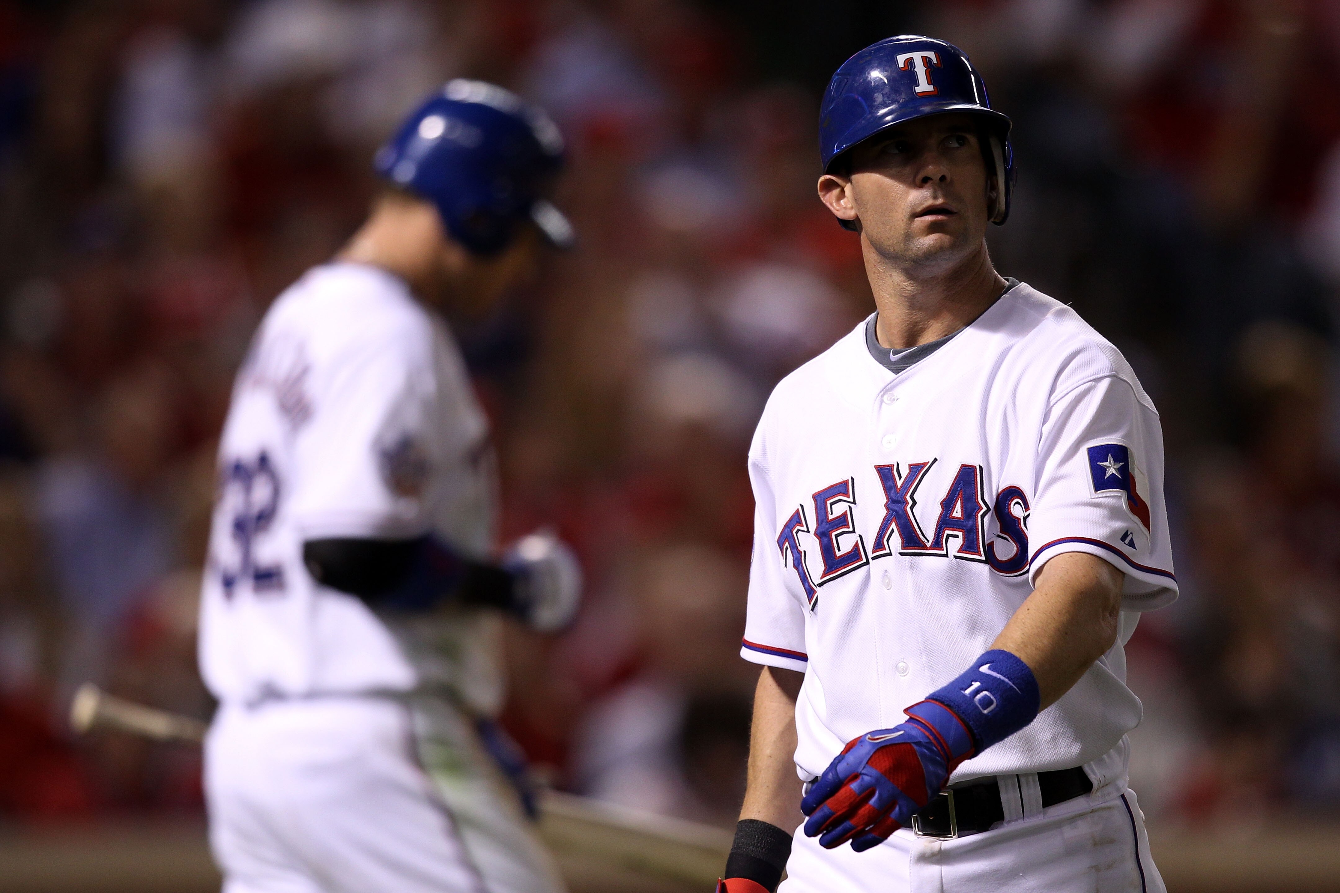 ARLINGTON, TX - OCTOBER 31:  Michael Young #10 of the Texas Rangers reacts as he walks back to the dugout after he struck out in the seventh inning against the San Francisco Giants in Game Four of the 2010 MLB World Series at Rangers Ballpark in Arlington