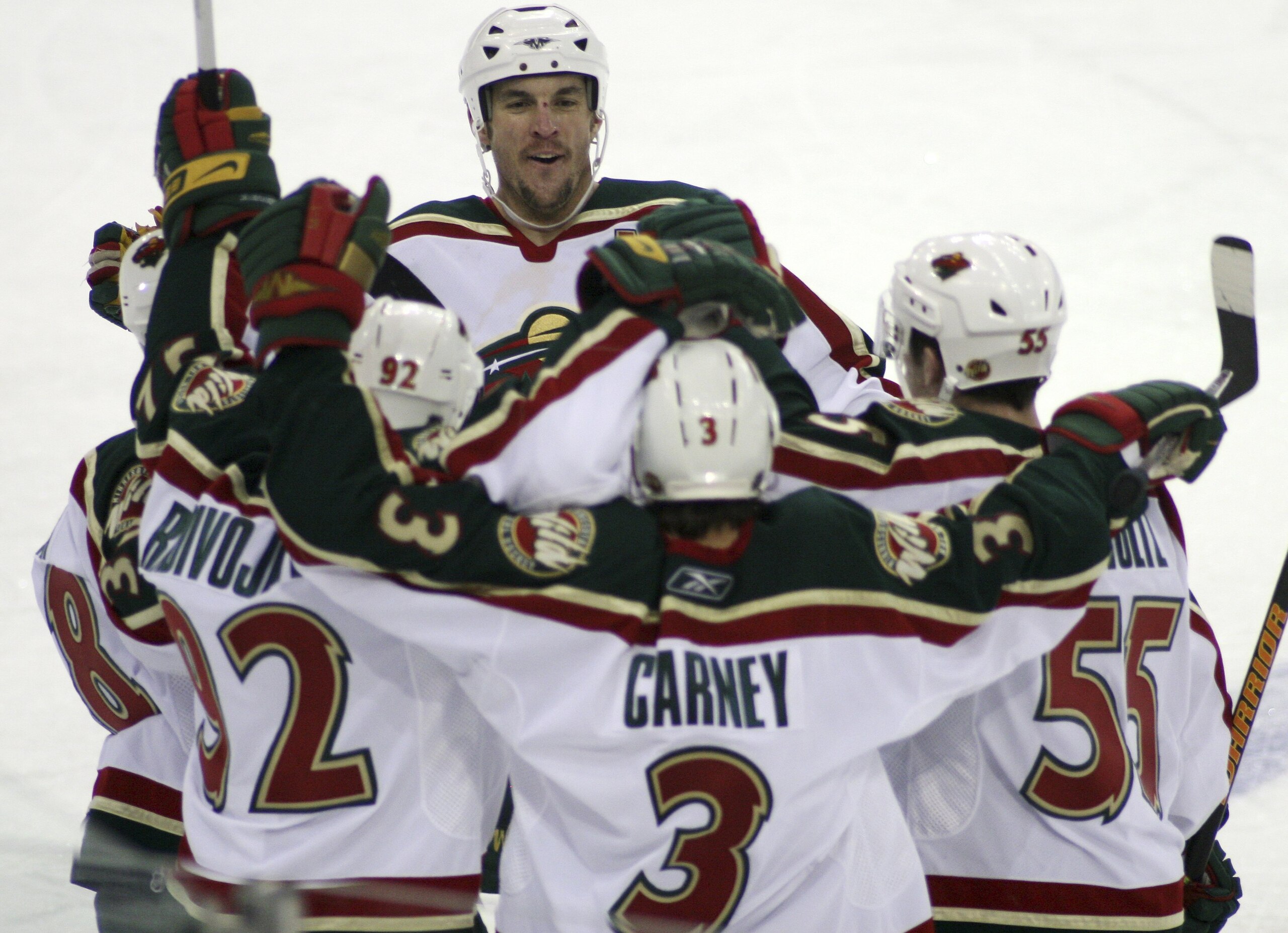 EDMONTON, CANADA - JANUARY 12:  Wes Walz #37 (Top-C) of the Minnesota Wild celebrates a goal by teammate Keith Carney #3 (C) with teammates Pavol Demitra #38 (L), Branko Radivojevic #92 and Nick Schultz #55 during the third period at Rexall Place January
