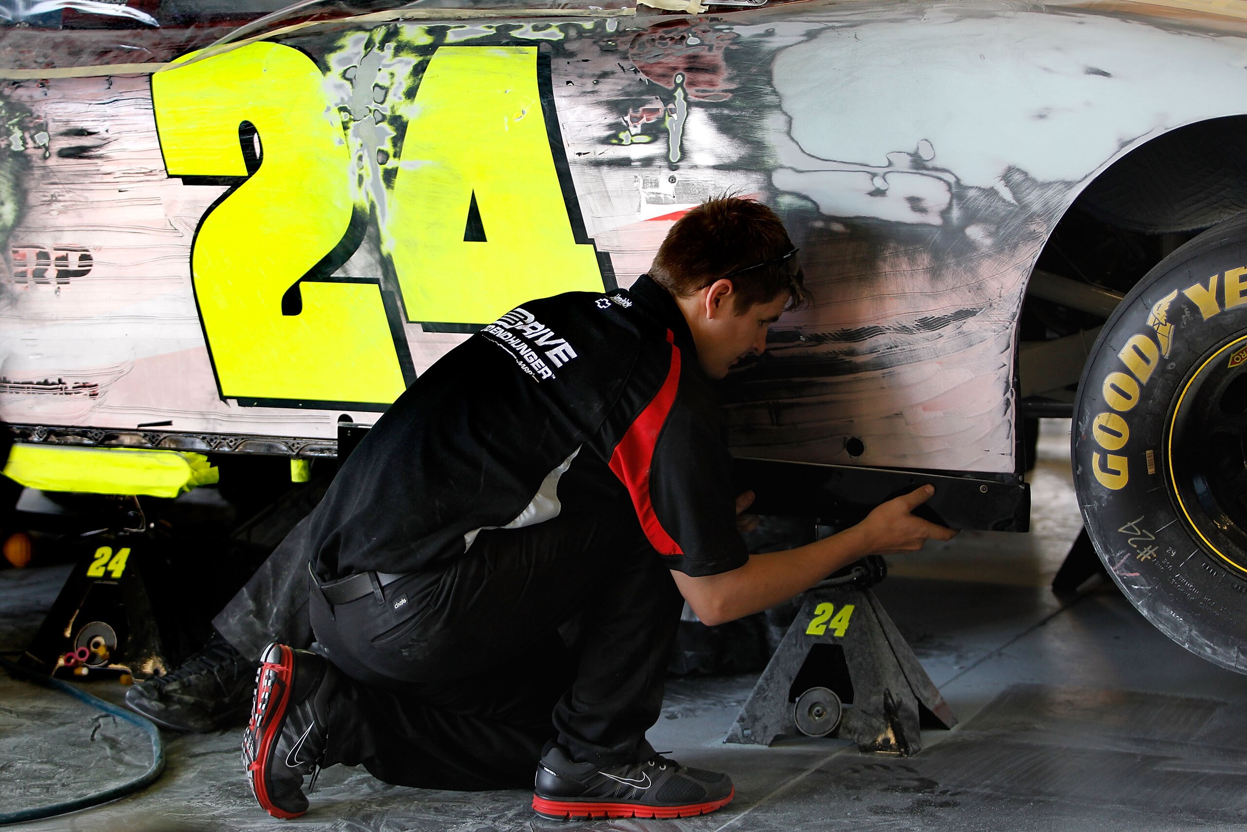 DAYTONA BEACH, FL - FEBRUARY 18:  Crew members work on the #24 Drive to End Hunger Chevrolet of Jeff Gordon during practice for the NASCAR Sprint Cup Series Daytona 500 at Daytona International Speedway on February 18, 2011 in Daytona Beach, Florida.  (Ph