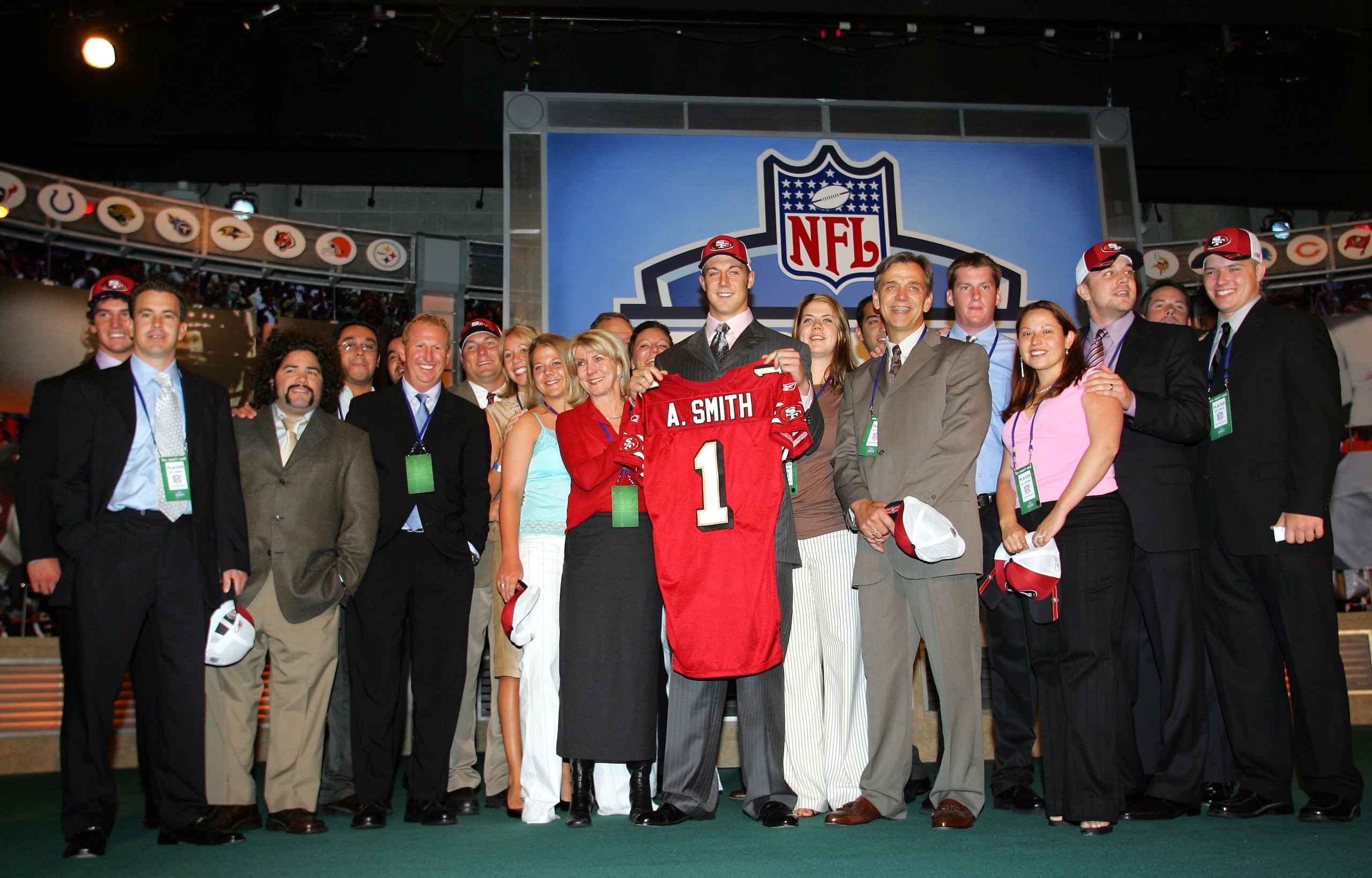 NEW YORK - APRIL 23:  Quarterback Alex Smith (C) (Utah), drafted first overall by the San Francisco 49ers, poses with his family during the 70th NFL Draft on April 23, 2005 at the Jacob K. Javits Convention Center in New York City.  (Photo by Chris Trotma