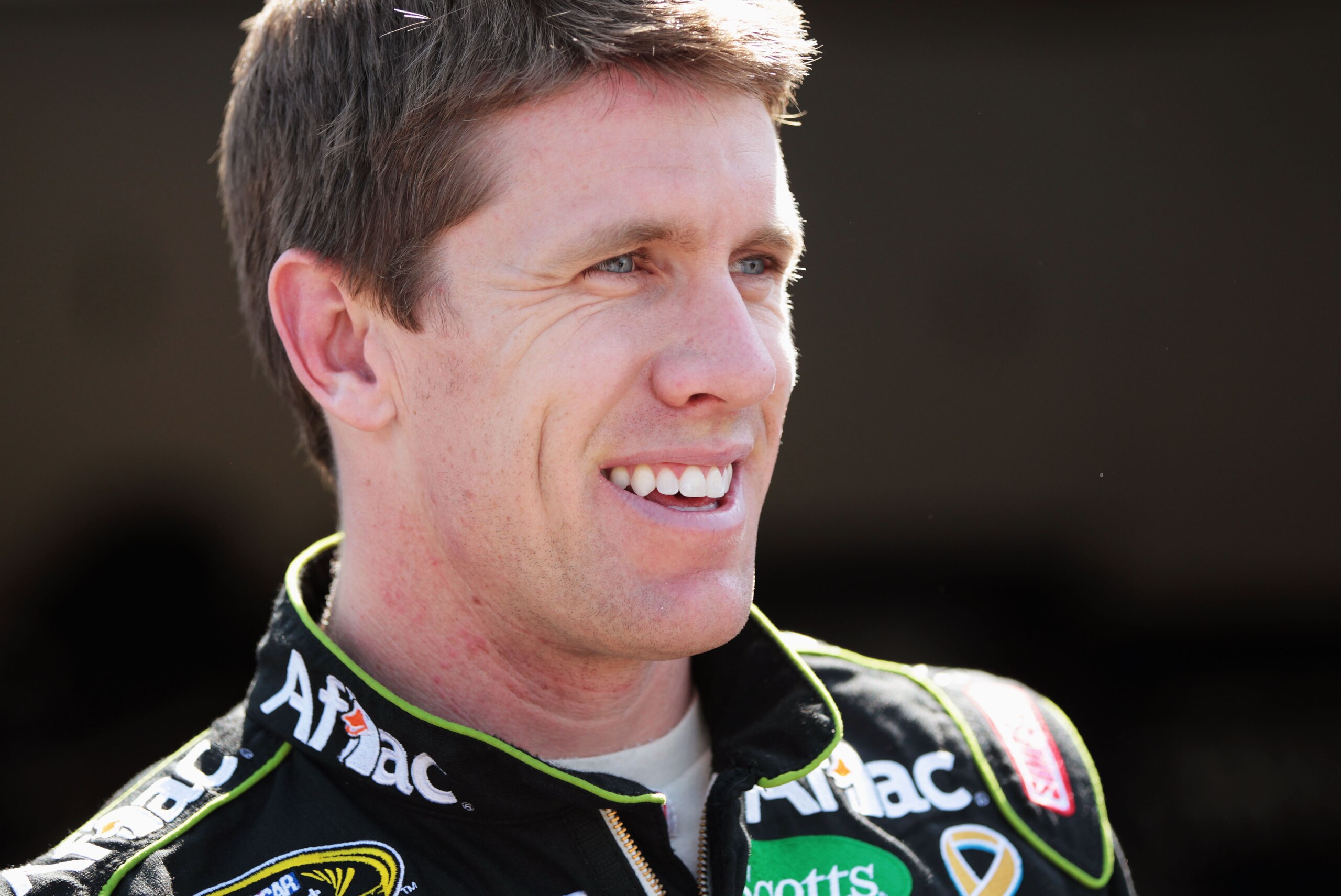 DAYTONA BEACH, FL - FEBRUARY 18:  Carl Edwards, driver of the #99 Aflac Ford, looks on in the garage area during practice for the NASCAR Sprint Cup Series Daytona 500 at Daytona International Speedway on February 18, 2011 in Daytona Beach, Florida.  (Phot