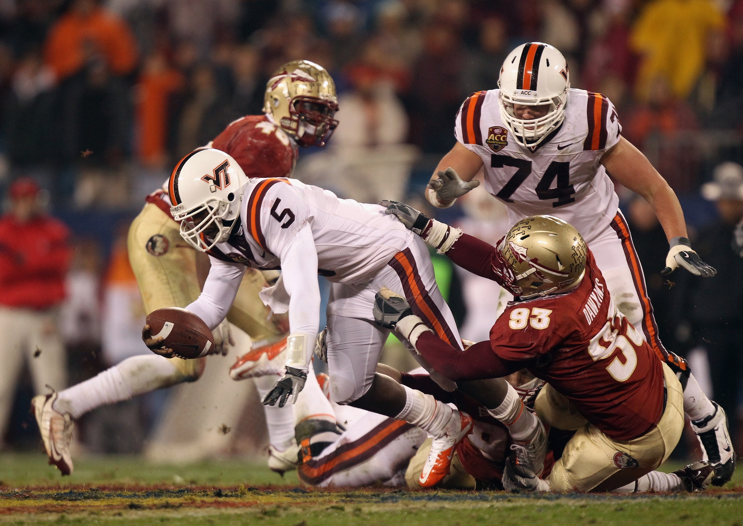 CHARLOTTE, NC - DECEMBER 04:  Everett Dawkins #93 of the Florida State Seminoles tackles Tyrod Taylor #5 of the Virginia Tech Hokies during their game at Bank of America Stadium on December 4, 2010 in Charlotte, North Carolina.  (Photo by Streeter Lecka/G
