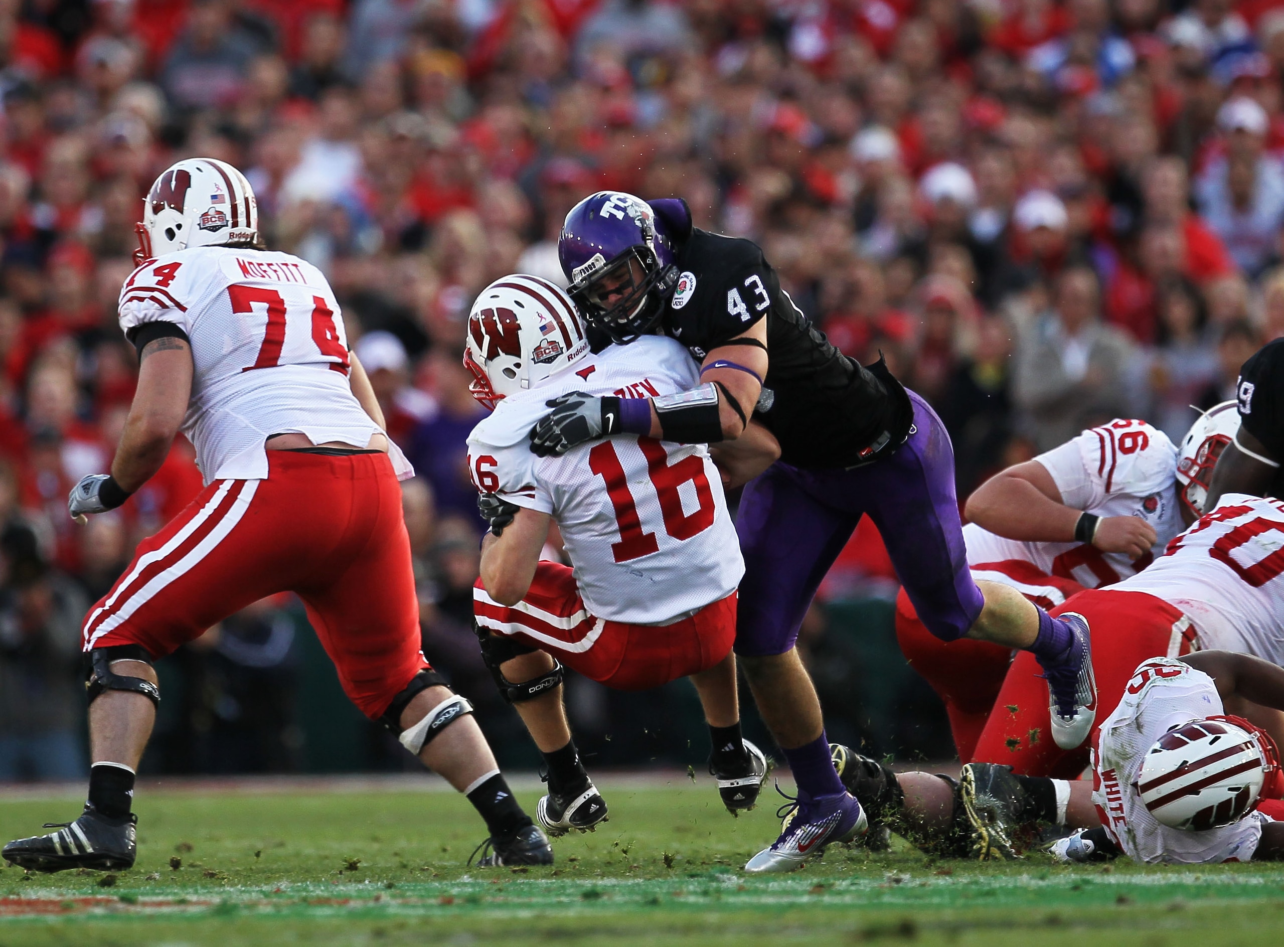 PASADENA, CA - JANUARY 01:  Quarterback Scott Tolzien #16 of the Wisconsin Badgers is sacked by linebacker Tank Carder #43 of the TCU Horned Frogs during the 97th Rose Bowl game on January 1, 2011 in Pasadena, California.  (Photo by Stephen Dunn/Getty Ima