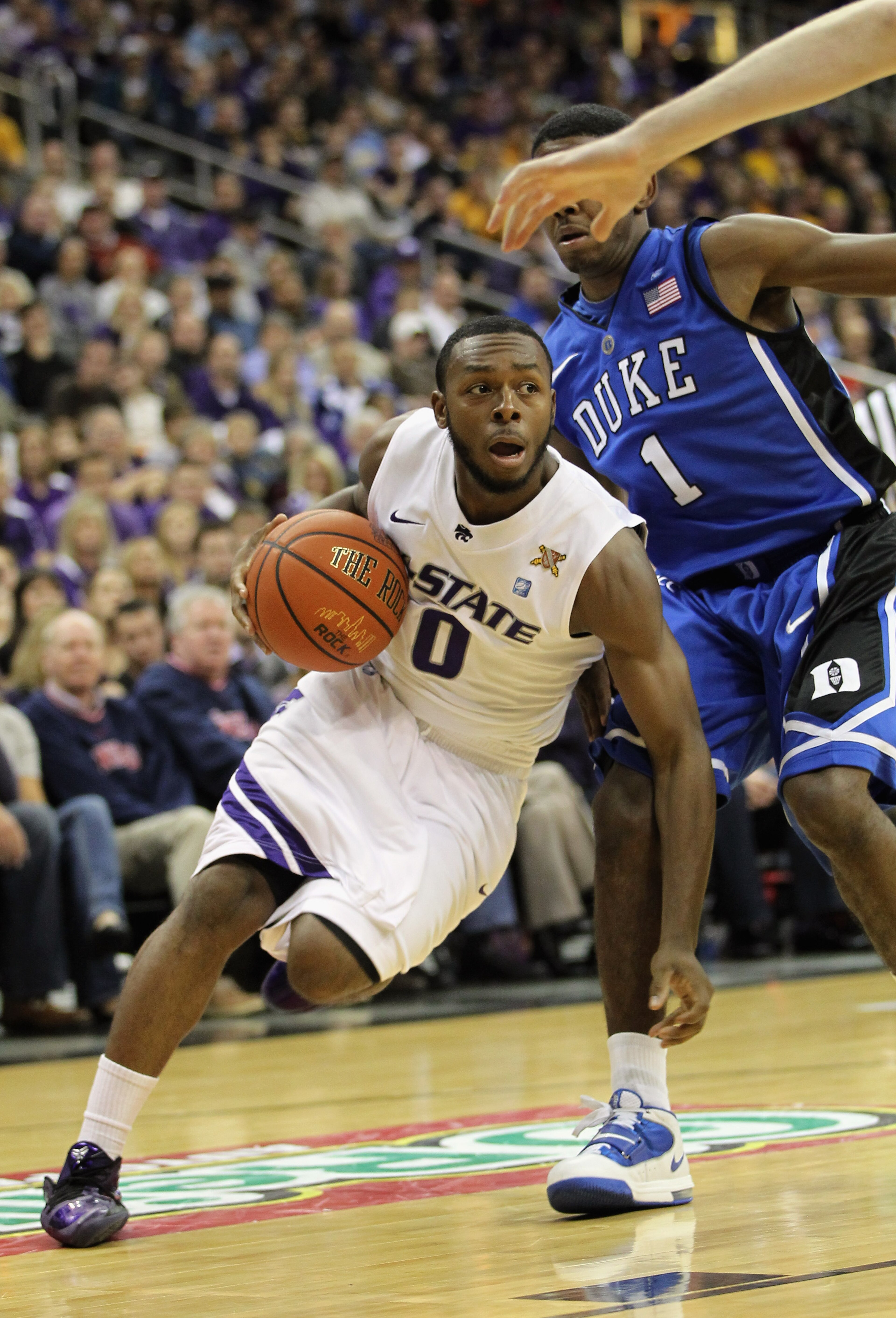 KANSAS CITY, MO - NOVEMBER 23: Jacob Pullen #0 of the Kansas State Wildcats drives as Kyrie Irving #1 of the Duke Blue Devils defends during the CBE Classic championship game on November 23, 2010 at the Sprint Center in Kansas City, Missouri. (Photo by KANSAS CITY, MO - NOVEMBER 23: Jacob Pullen #0 of the Kansas State Wildcats drives as Kyrie Irving #1 of the Duke Blue Devils defends during the CBE Classic championship game on November 23, 2010 at the Sprint Center in Kansas City, Missouri. (Photo by