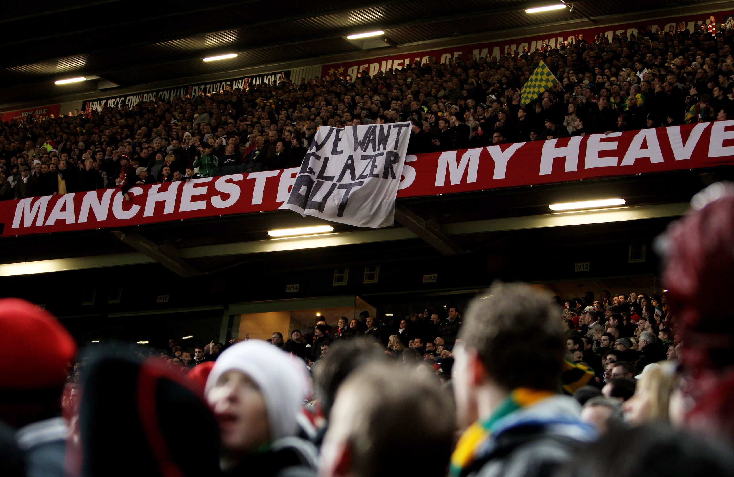 MANCHESTER, ENGLAND - JANUARY 23:  Manchester United fans protest against the Glazers, current owners of Manchester United in the Stretford End stand during the Barclays Premier League match between Manchester United and Hull City at Old Trafford on Janua