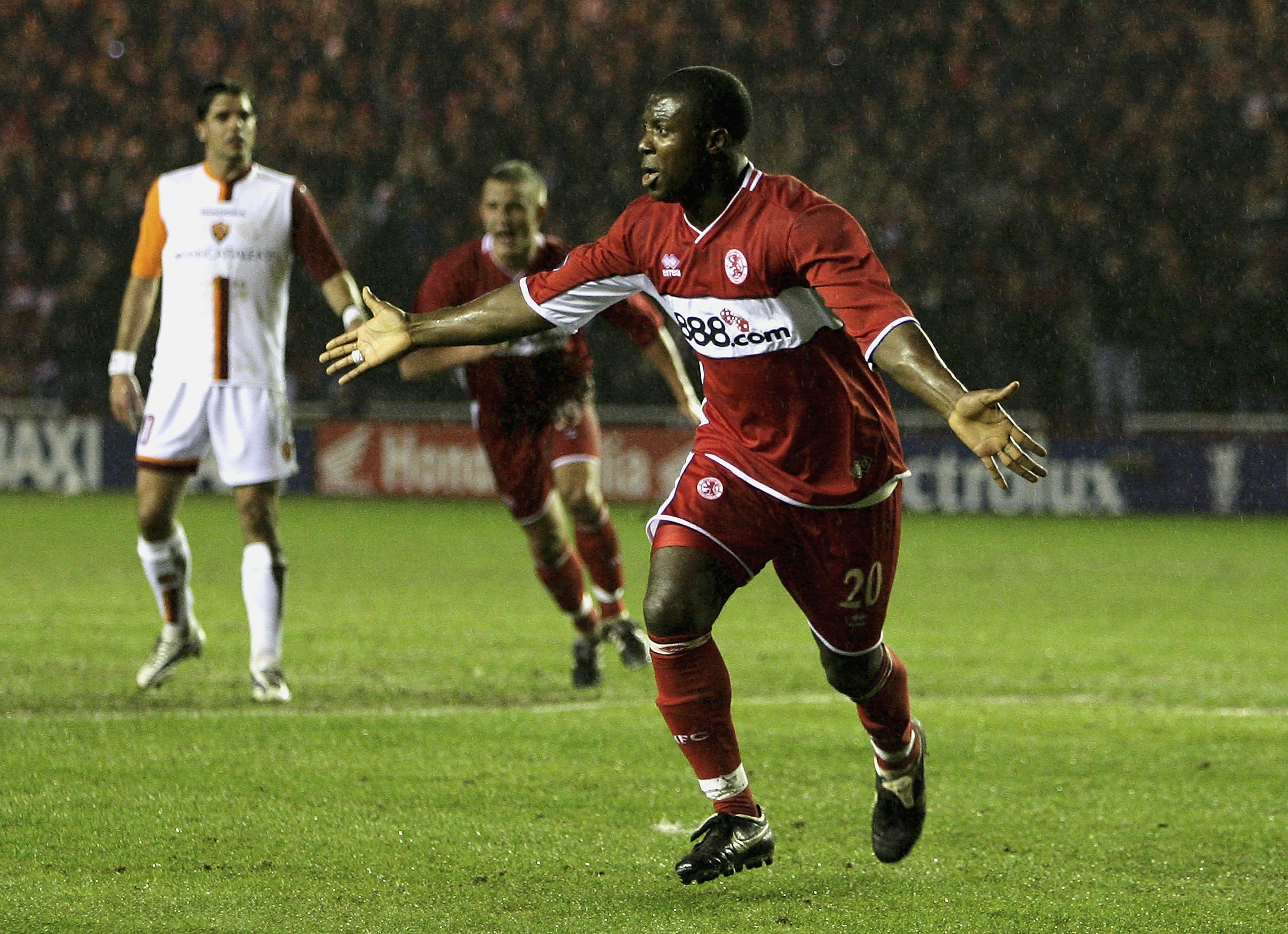 MIDDLESBROUGH, ENGLAND - MARCH 9:  Yakubu of Middlesbrough celebrates his goal during the UEFA Cup Round of 16, First Leg match between Middlesbrough and AS Roma at the Riverside Stadium on March 9, 2006 in Middlesbrough, England. (Photo by Matthew Lewis/
