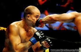 Georges St-Pierre landing a left hook on B.J. Penn