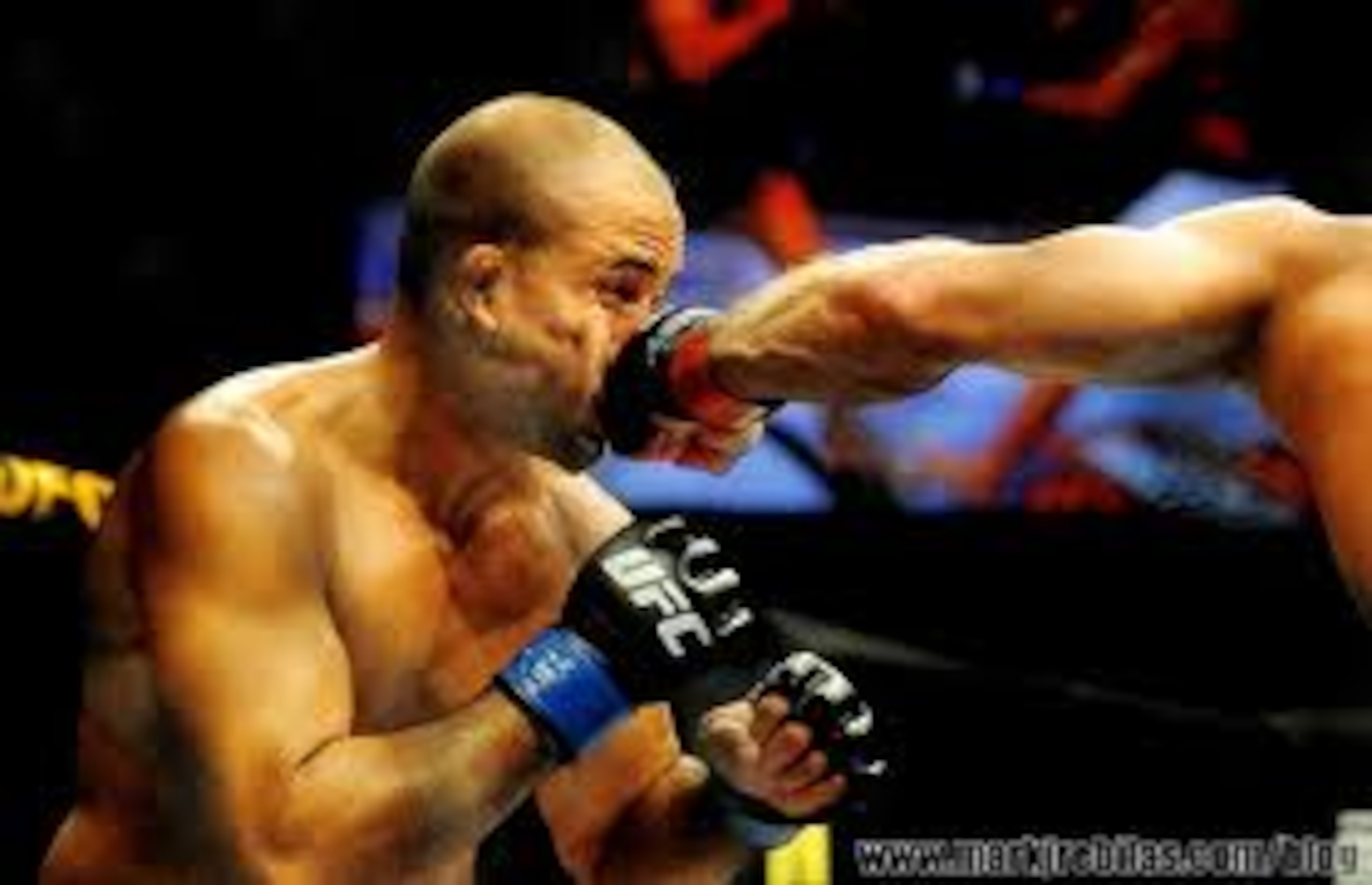 Georges St-Pierre landing a left hook on B.J. Penn