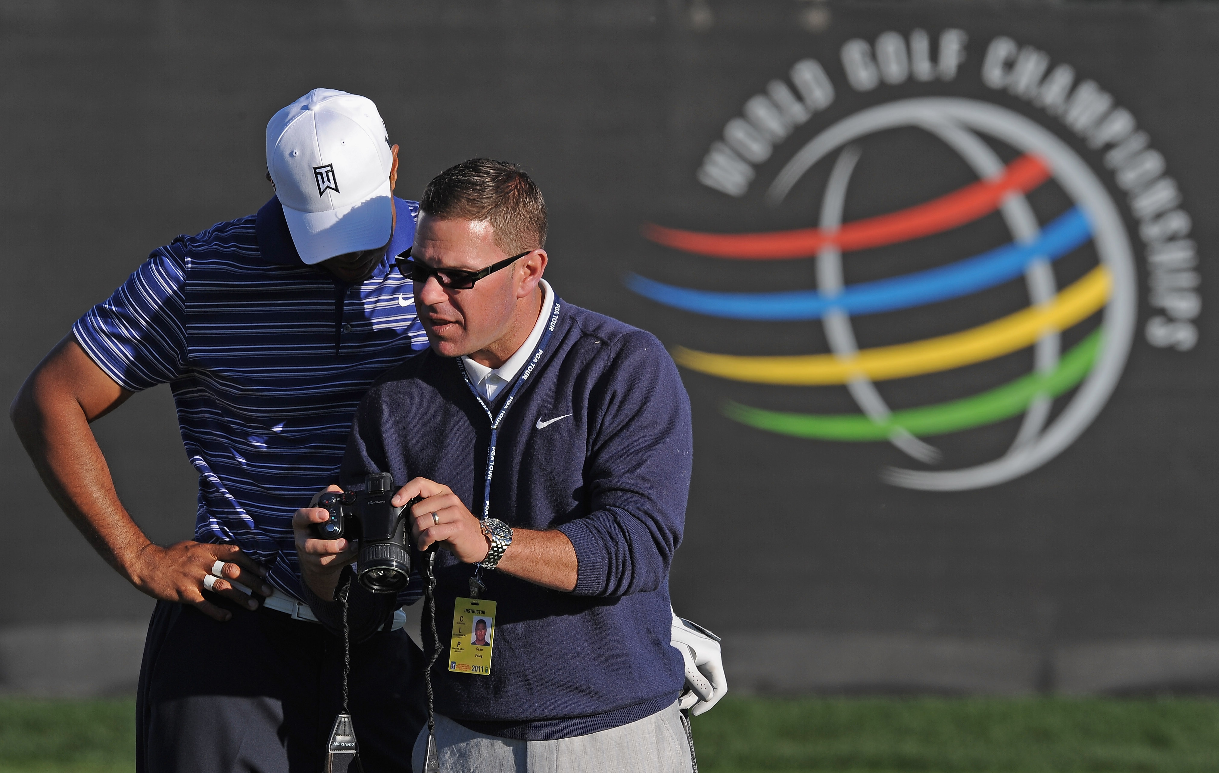 MARANA, AZ - FEBRUARY 22:  Tiger Woods  looks at a video with coach Sean Foley during practice prior to the start of the World Golf Championships-Accenture Match Play Championship held at The Ritz-Carlton Golf Club, Dove Mountain on February 22, 2011 in M