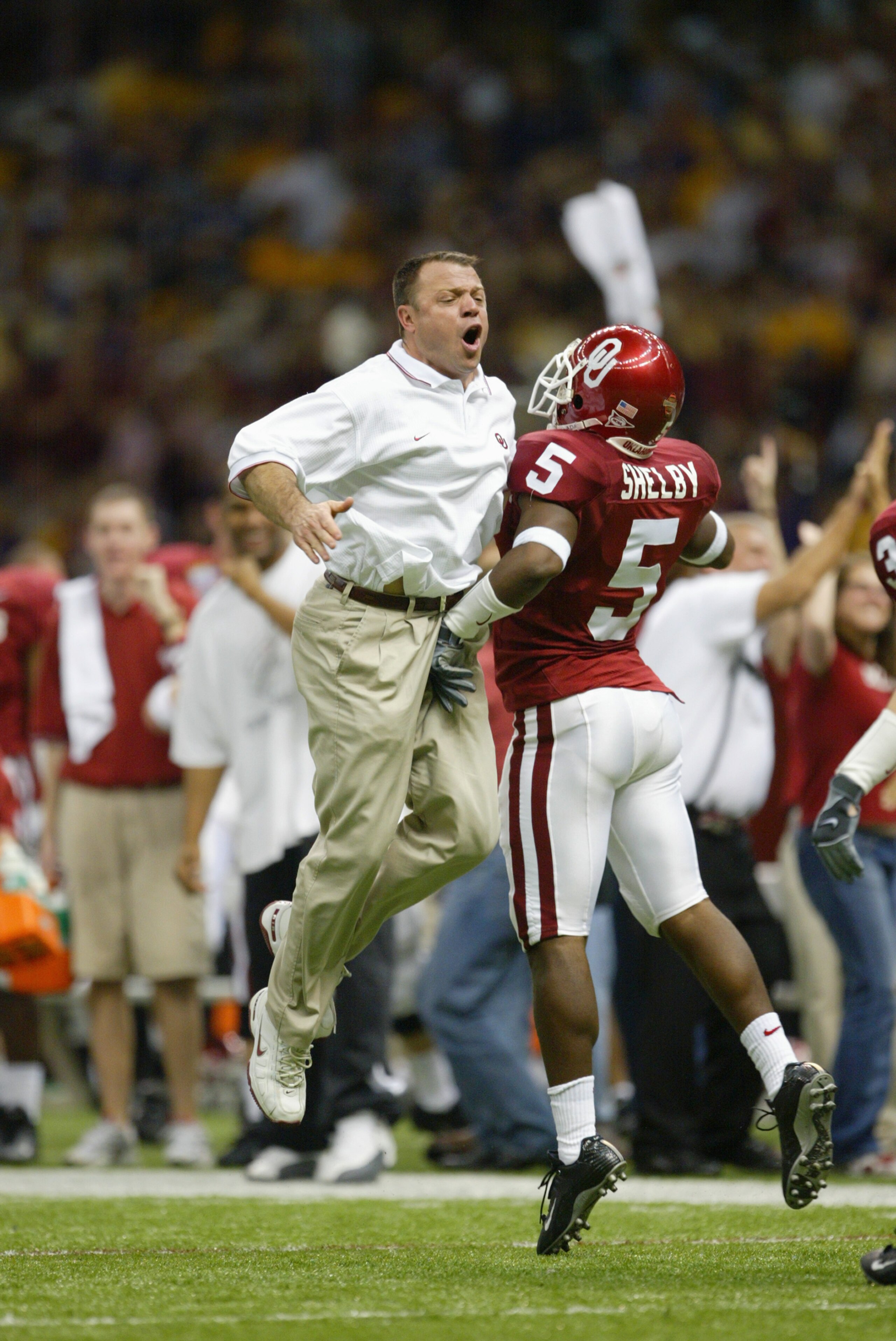 NEW ORLEANS - JANUARY 4:  Director of Sports Enhancement Jerry Schmidt of the University of Oklahoma Sooners celebrates with his teammate cornerback Brandon Shelby #5 during the National Championship Nokia Sugar Bowl game against the Louisiana State Unive