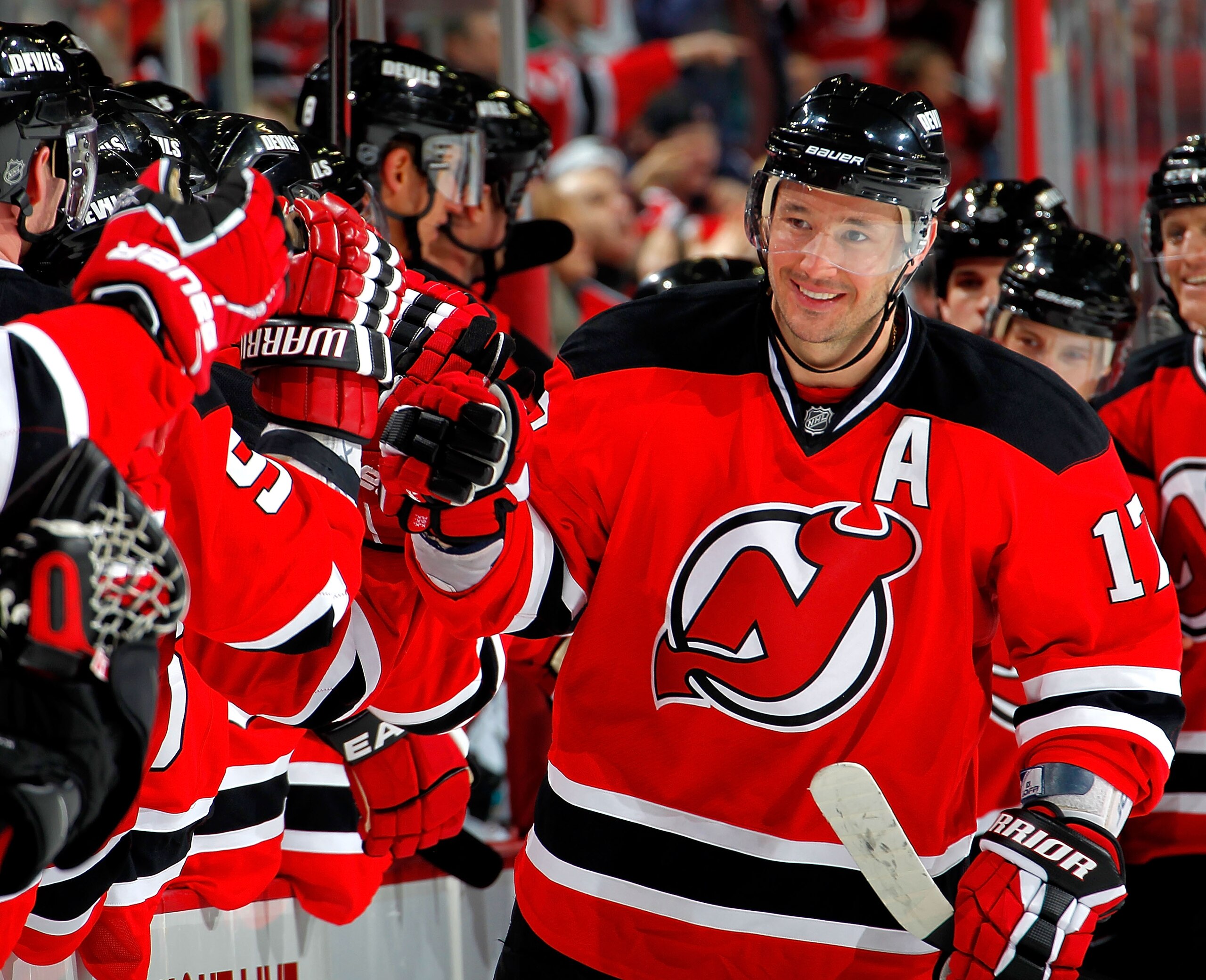 NEWARK, NJ - FEBRUARY 11: Ilya Kovalchuk #17 of the New Jersey Devils celebrates with teammates on the bench after scoring a goal in the third period of the Devils 2-1 win in an NHL hockey game against the San Jose Sharks on February 11, 2011 at the Prud NEWARK, NJ - FEBRUARY 11: Ilya Kovalchuk #17 of the New Jersey Devils celebrates with teammates on the bench after scoring a goal in the third period of the Devils 2-1 win in an NHL hockey game against the San Jose Sharks on February 11, 2011 at the Prud