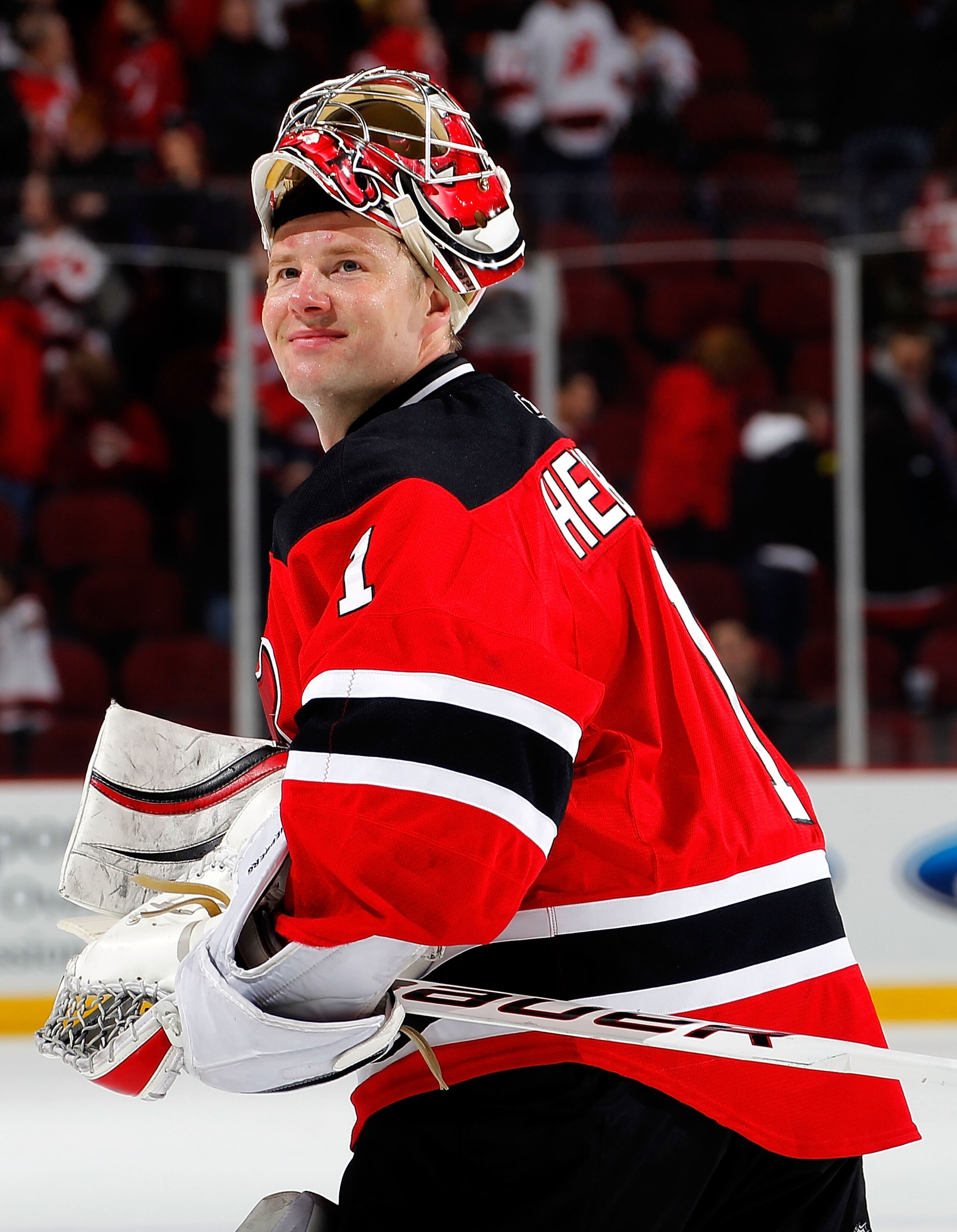 NEWARK, NJ - FEBRUARY 11: Goalie Johan Hedberg #1 of the New Jersey Devils smiles as he looks up to the crowd after a Devils win in an NHL hockey game against the San Jose Sharks on February 11, 2011 at the Prudential Center in Newark, New Jersey. (Photo NEWARK, NJ - FEBRUARY 11: Goalie Johan Hedberg #1 of the New Jersey Devils smiles as he looks up to the crowd after a Devils win in an NHL hockey game against the San Jose Sharks on February 11, 2011 at the Prudential Center in Newark, New Jersey. (Photo