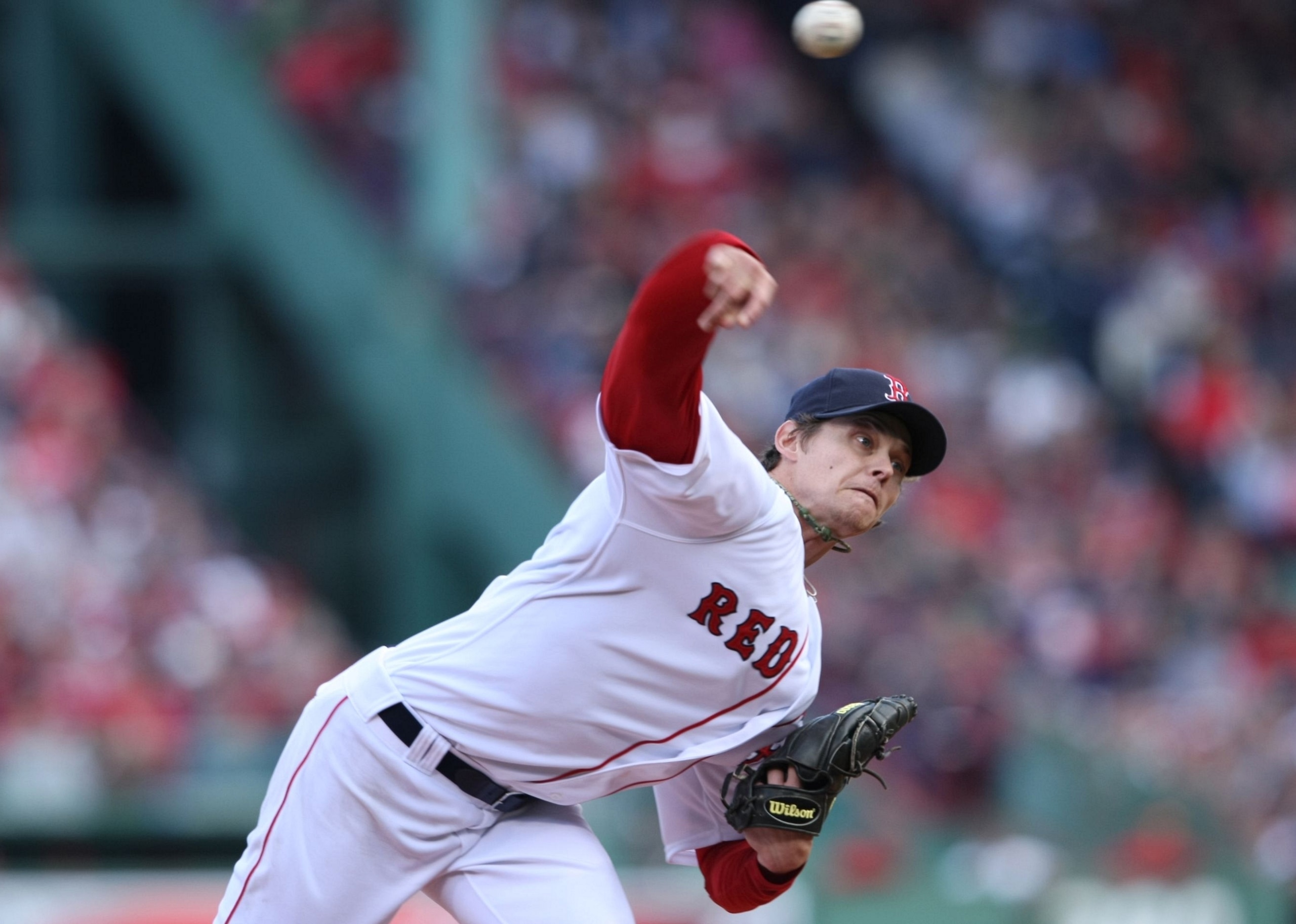 BOSTON - OCTOBER 11: Starting pitcher Clay Buchholz #61 of the Boston Red Sox delivers a pitch against the Los Angeles Angels of Anaheim in Game Three of the ALDS during the 2009 MLB Playoffs at Fenway Park on October 11, 2009 in Boston, Massachusetts. (P