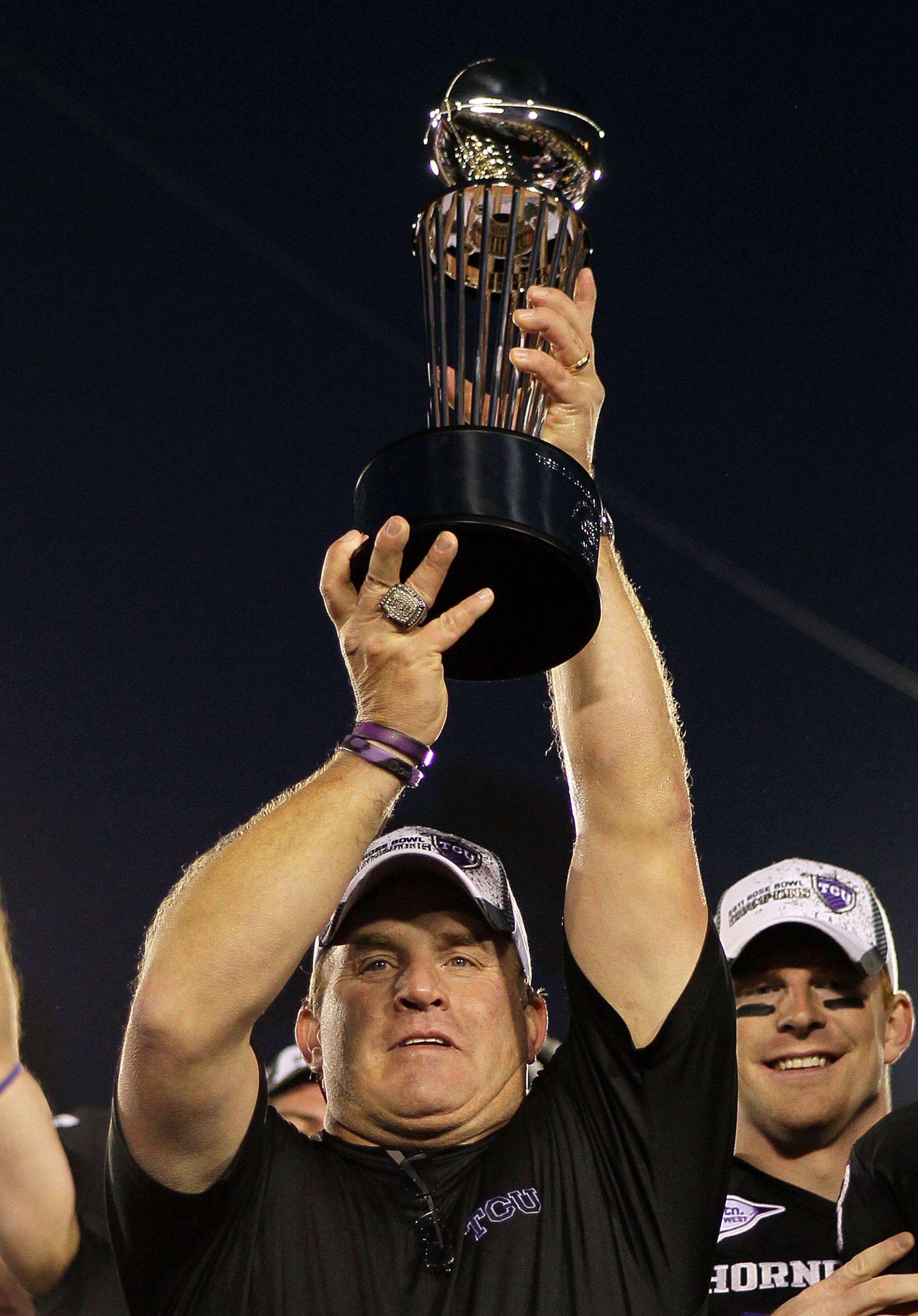 PASADENA, CA - JANUARY 01:  Head coach Gary Patterson of the TCU Horned Frogs holds the Rose Bowl Championship Trophy after defeating the Wisconsin Badgers 21-19 in the 97th Rose Bowl game on January 1, 2011 in Pasadena, California.  (Photo by Jeff Gross/