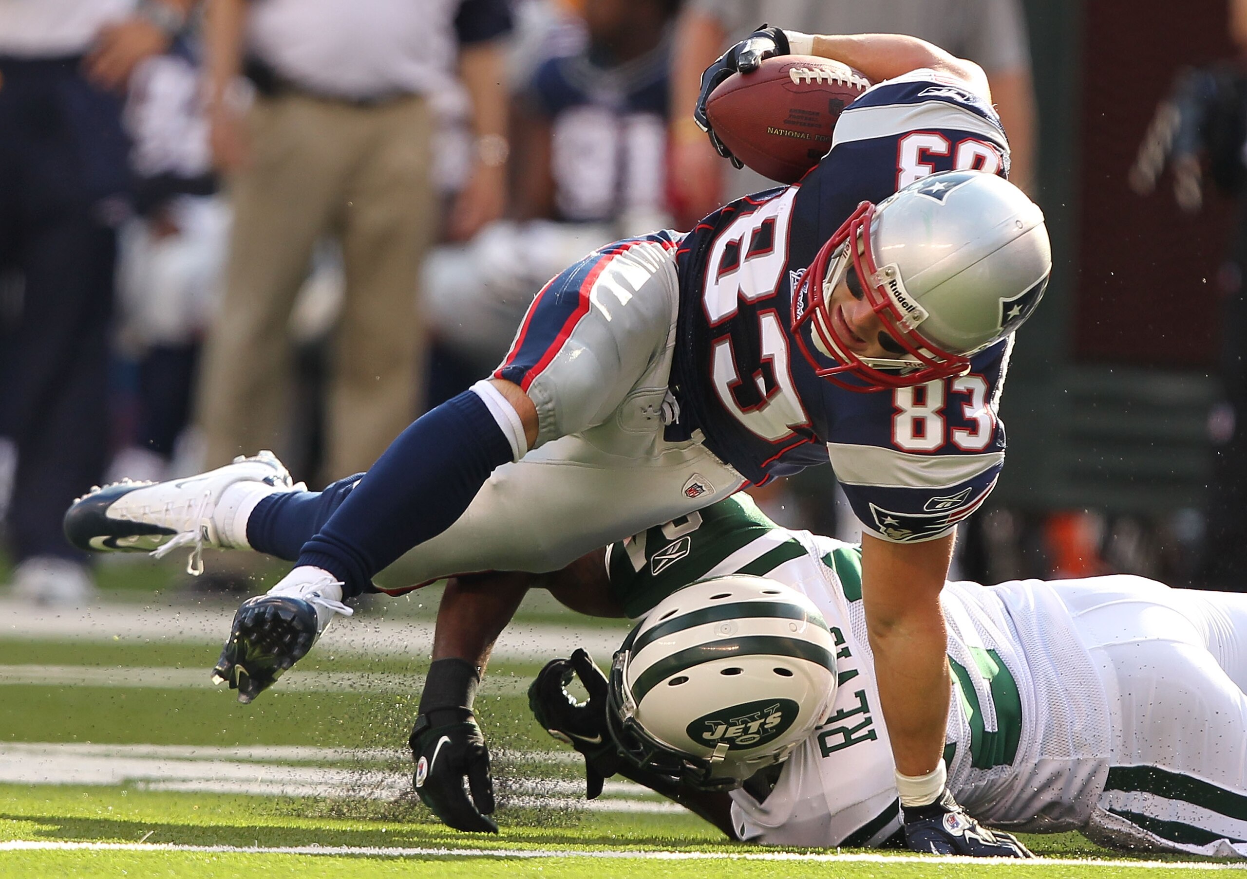 EAST RUTHERFORD, NJ - SEPTEMBER 19: Darrelle Revis #24 of the New York Jets tackles Wes Welker #83 of the New England Patriots during their game on September 19, 2010 at the New Meadowlands Stadium in East Rutherford, New Jersey. (Photo by Al Bello/Ge EAST RUTHERFORD, NJ - SEPTEMBER 19: Darrelle Revis #24 of the New York Jets tackles Wes Welker #83 of the New England Patriots during their game on September 19, 2010 at the New Meadowlands Stadium in East Rutherford, New Jersey. (Photo by Al Bello/Ge