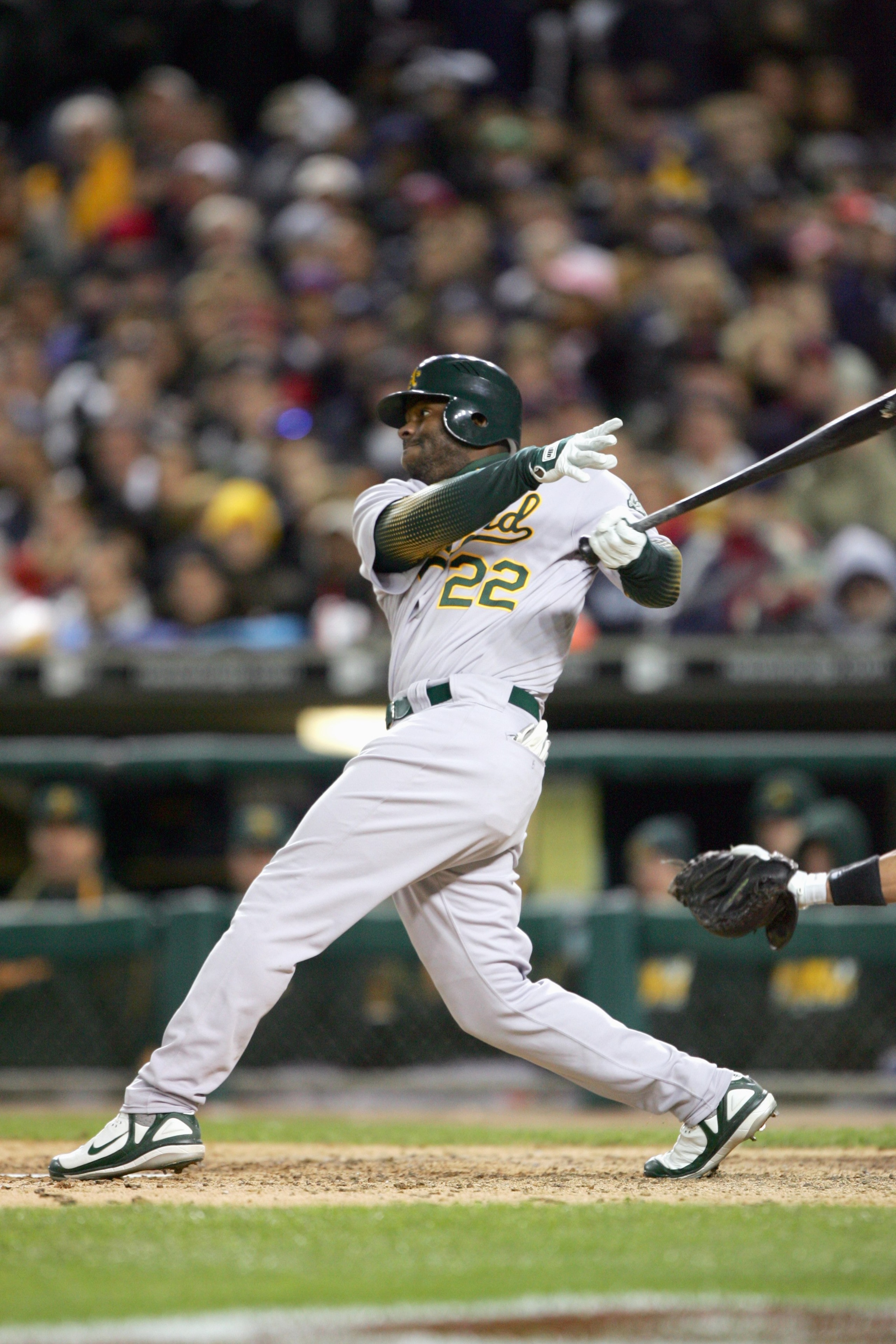 DETROIT - OCTOBER 14:  Milton Bradley #22 of the Oakland Athletics swings at the pitch against the Detroit Tigers during Game Four of the American League Championship Series on October 14, 2006 at Comerica Park in Detroit, Michigan. (Photo by Jed Jacobsoh