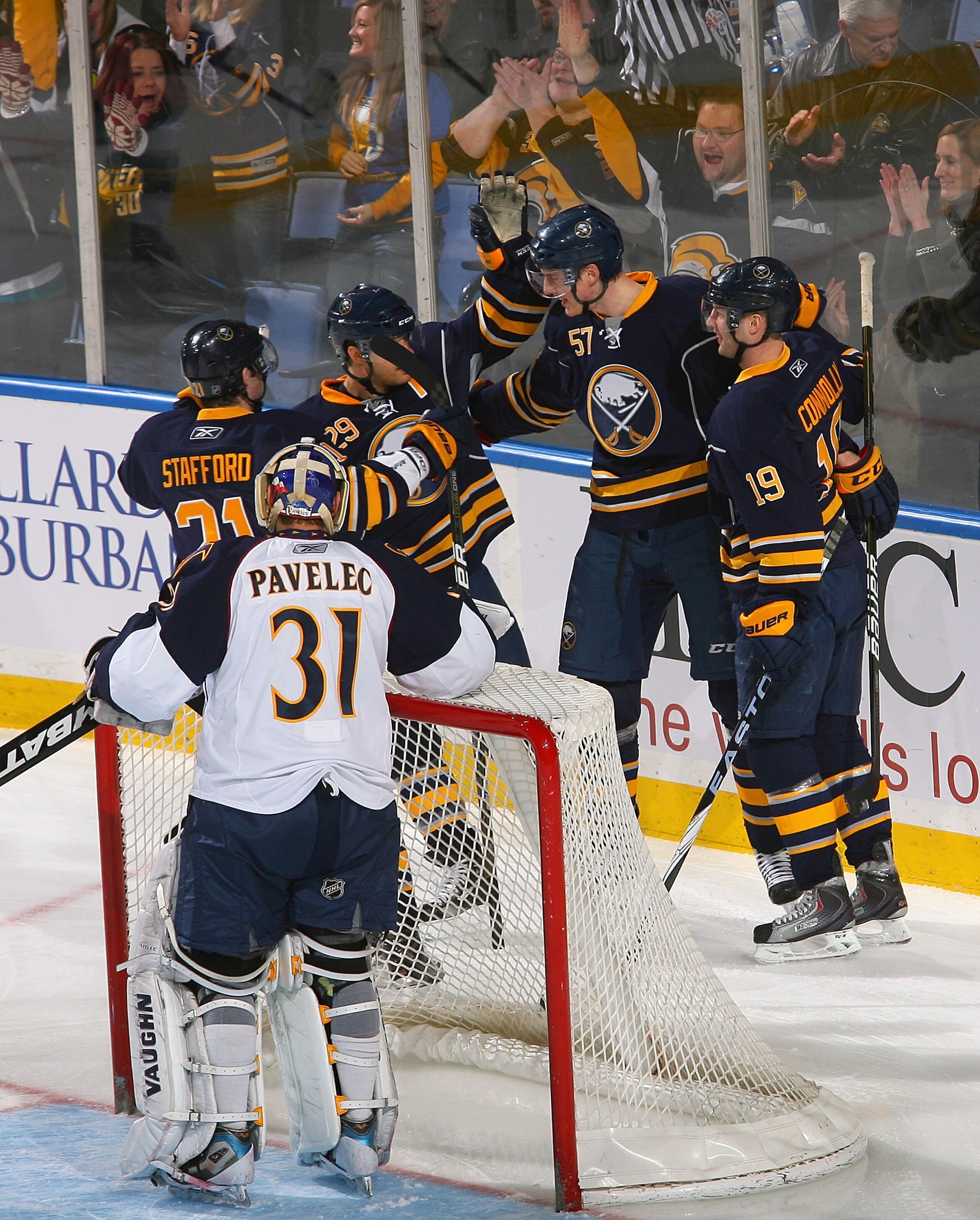 BUFFALO, NY - FEBRUARY 23: Drew Stafford #21, Jason Pominville #29, Tyler Myers and Tim Connolly #19  of the Buffalo Sabres celebrate Myers' goal in the first period against Ondrej Pavelec #31 of the Atlanta Thrashers at HSBC Arena on February 23, 2011 in