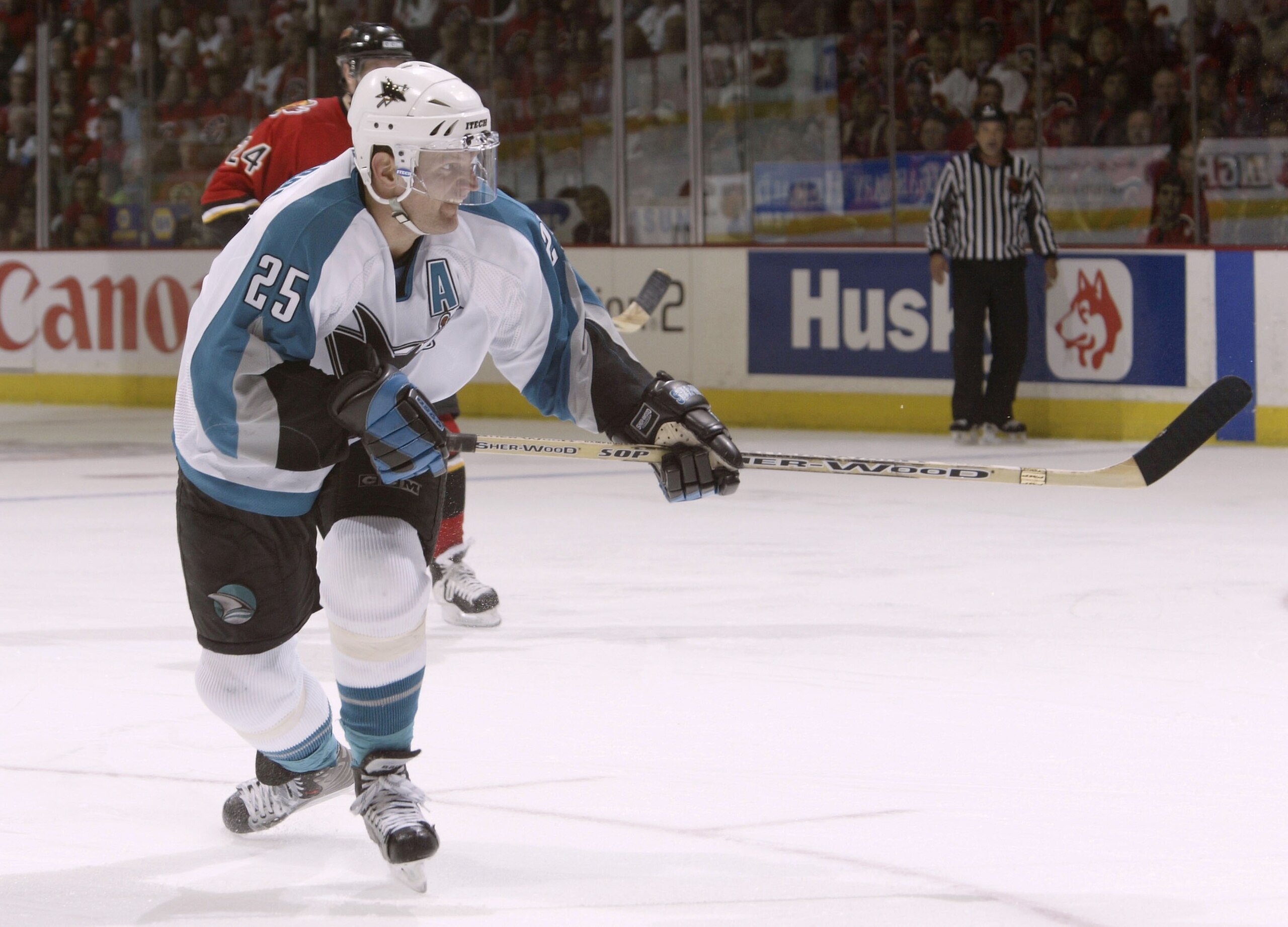 CALGARY, ALBERTA, CANADA - MAY 13:  Vincent Damphousse #25 of the San Jose Sharks scores a goal on a backhand shot against the Calgary Flames during Game three of the 2004 NHL Western Conference Finals on May 13, 2004 at the Pengrowth Saddledome in Calgar
