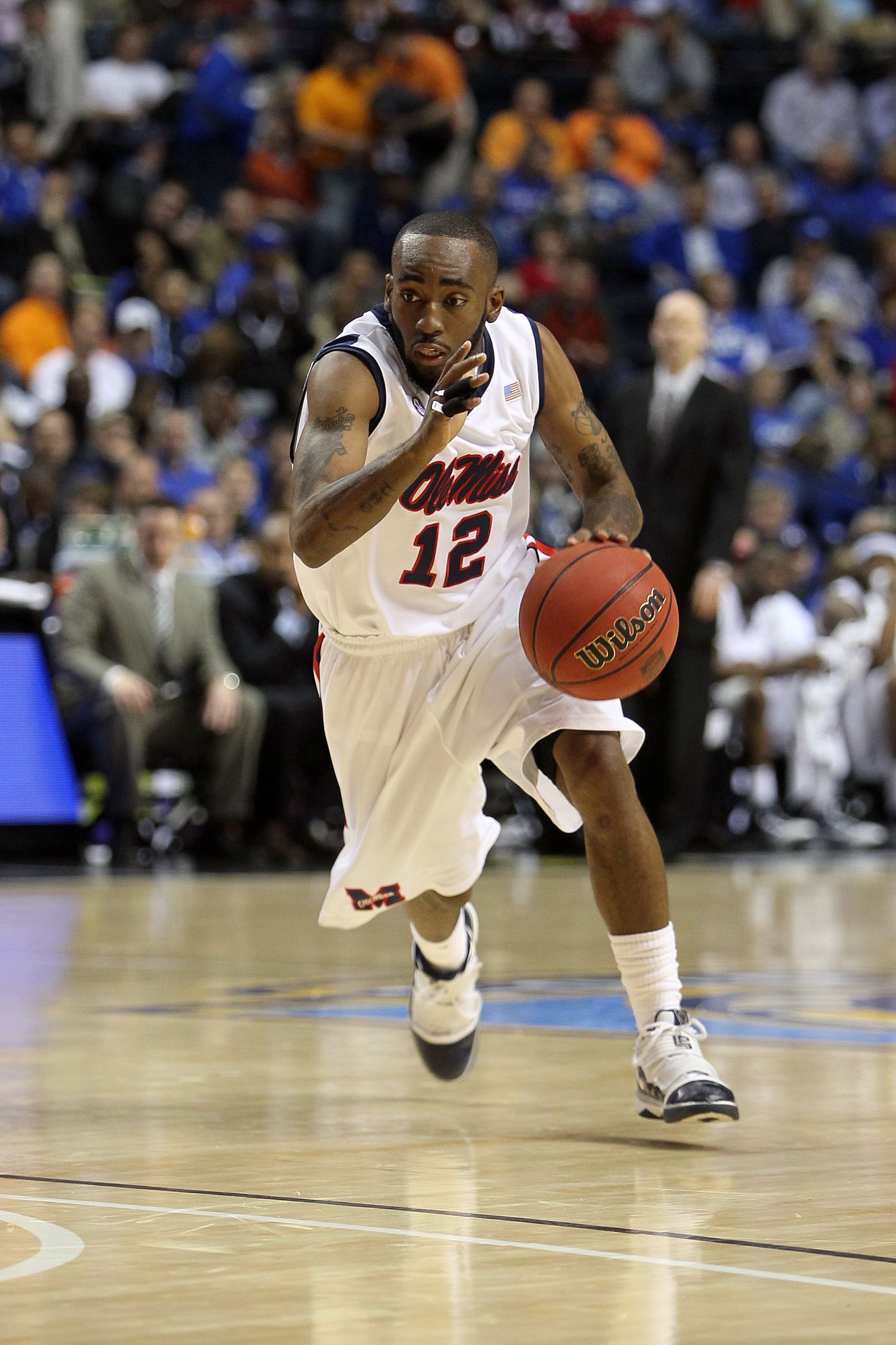 NASHVILLE, TN - MARCH 12:  Chris Warren #12 of the Mississippi Rebels drives against the Tennessee Volunteers during the quarterfinals of the SEC Men's Basketball Tournament at the Bridgestone Arena on March 12, 2010 in Nashville, Tennessee.  (Photo by An
