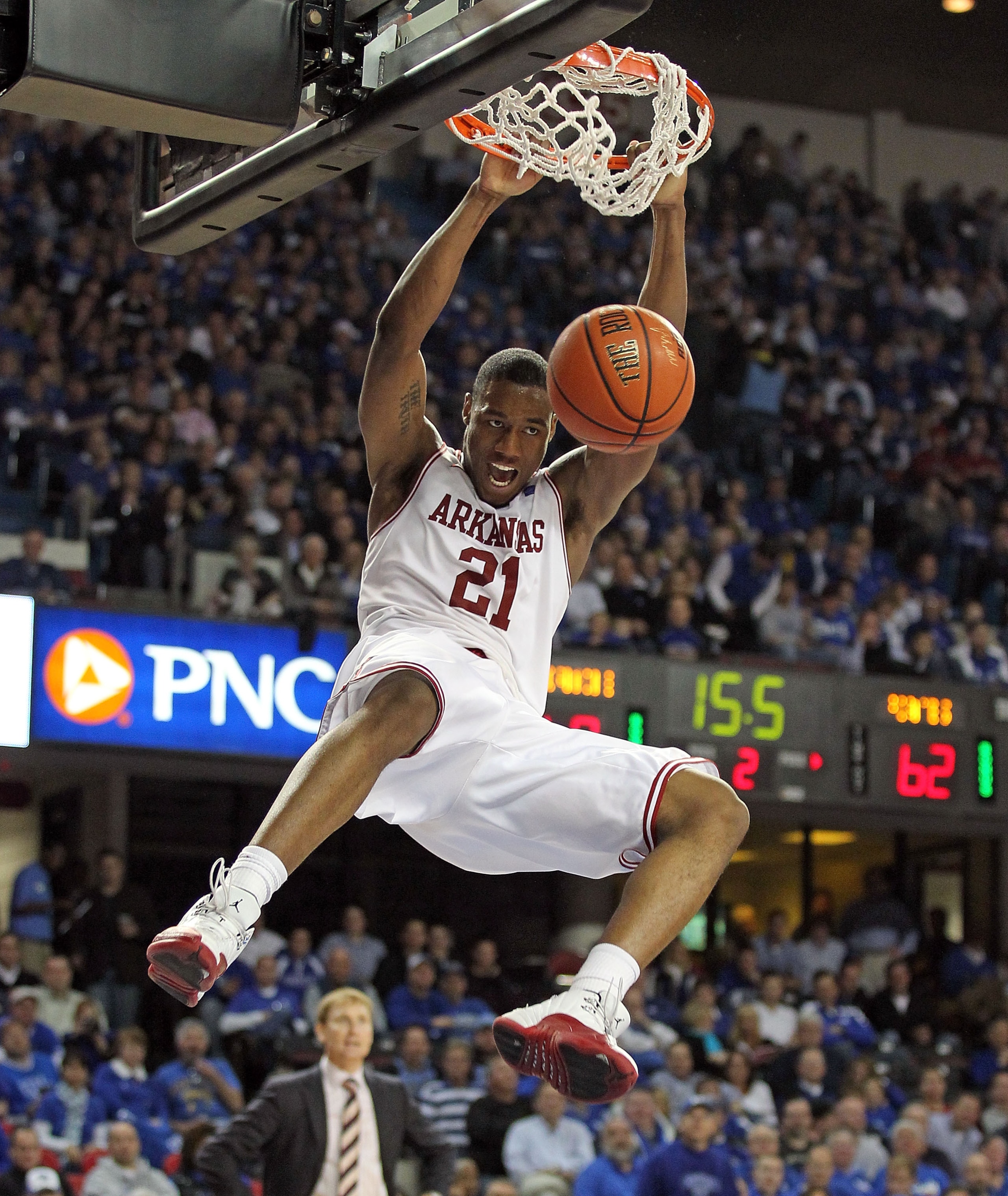 LOUISVILLE, KY - DECEMBER 08:  Delvon Johnson #21 of the Arkansas Razorbacks dunks the ball during the game against the Seton Hall Pirates in the 2010 DIRECTV SEC/BIG EAST Invitational at Freedom Hall on December 8, 2010 in Louisville, Kentucky.  (Photo b