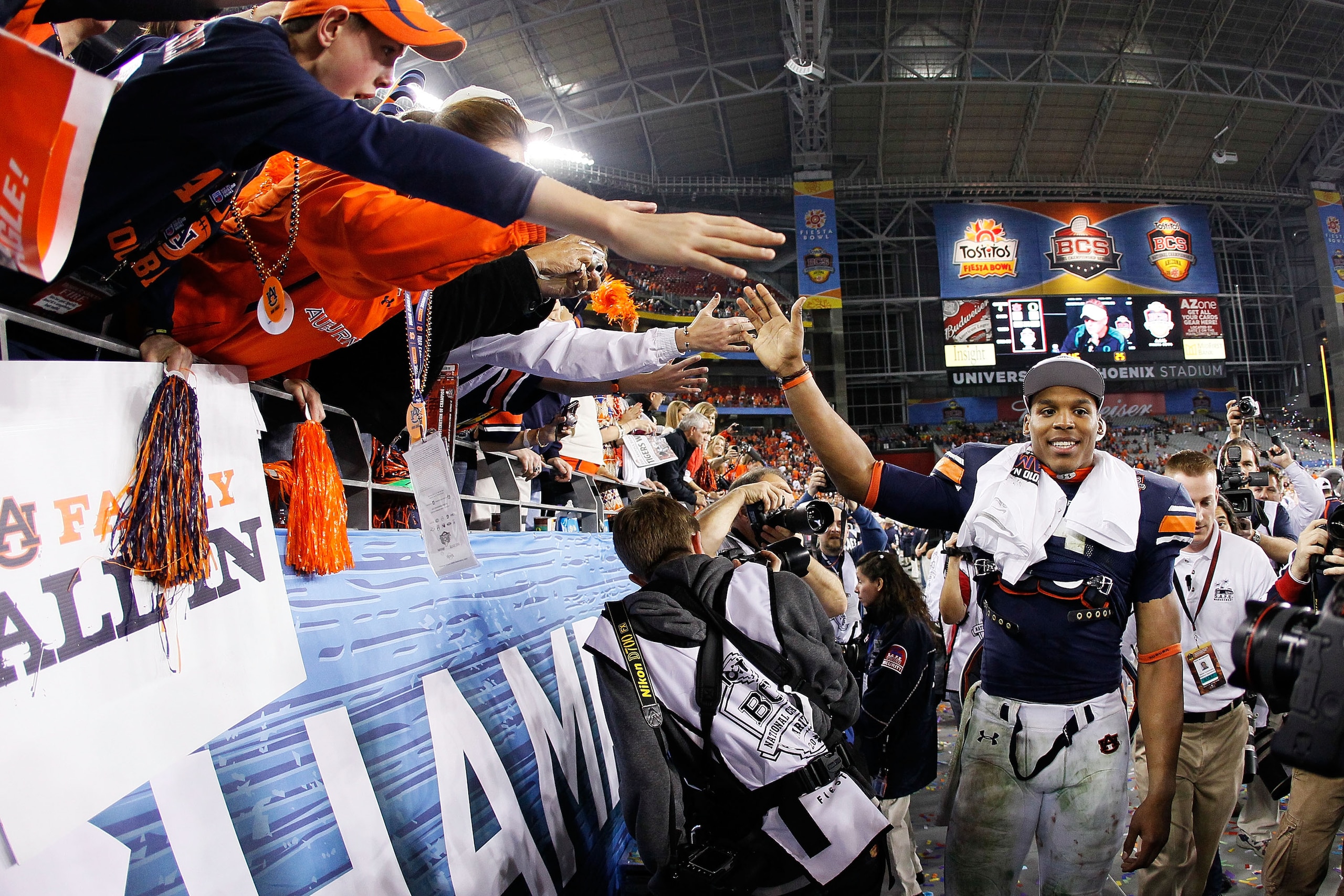 GLENDALE, AZ - JANUARY 10: Quarterback Cameron Newton #2 of the Auburn Tigers celebrates their 22-19 victory after defeating the Oregon Ducks in the Tostitos BCS National Championship Game at University of Phoenix Stadium on January 10, 2011 in Glendale, GLENDALE, AZ - JANUARY 10: Quarterback Cameron Newton #2 of the Auburn Tigers celebrates their 22-19 victory after defeating the Oregon Ducks in the Tostitos BCS National Championship Game at University of Phoenix Stadium on January 10, 2011 in Glendale,