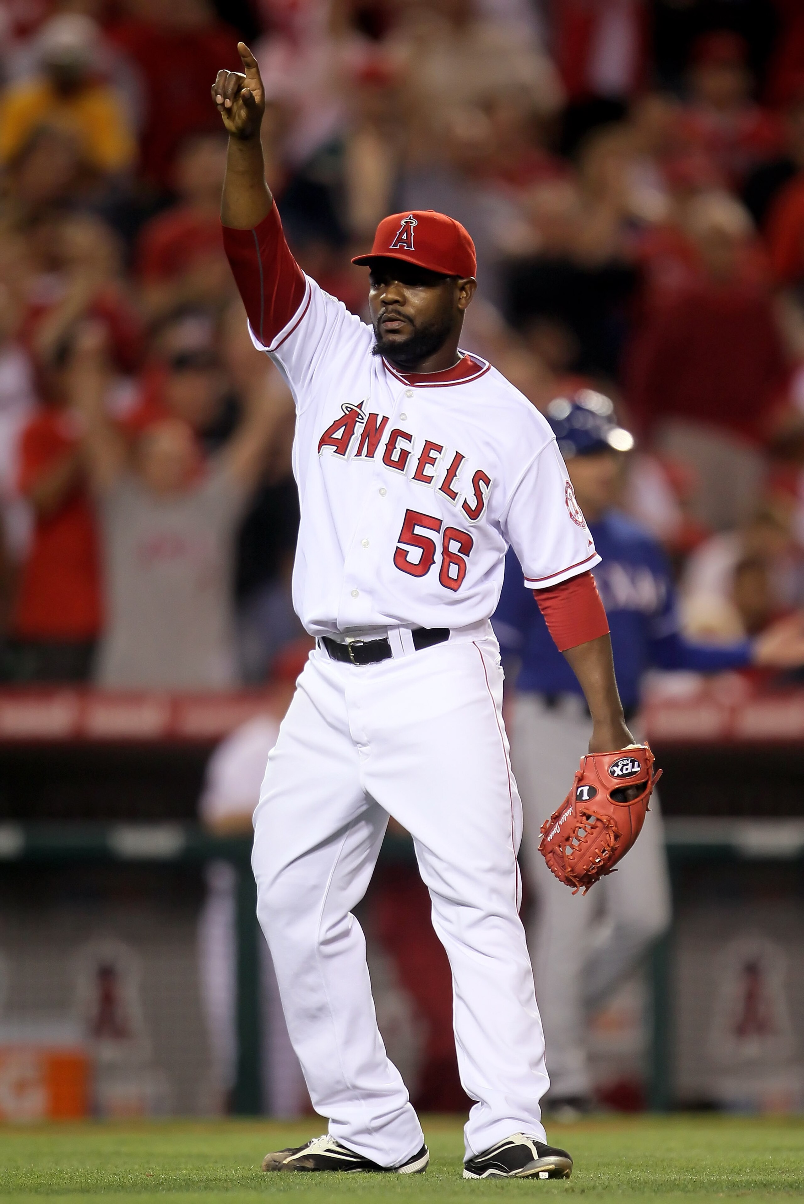 ANAHEIM, CA - JULY 01:  Relief pitcher Fernando Rodney #56 of the Los Angeles Angels of Anaheim celebrates after getting Nelson Cruz of the Texas Rangers to pop out in the eighth inning at Anaheim Stadium on July 1, 2010 in Anaheim, California. The Angels