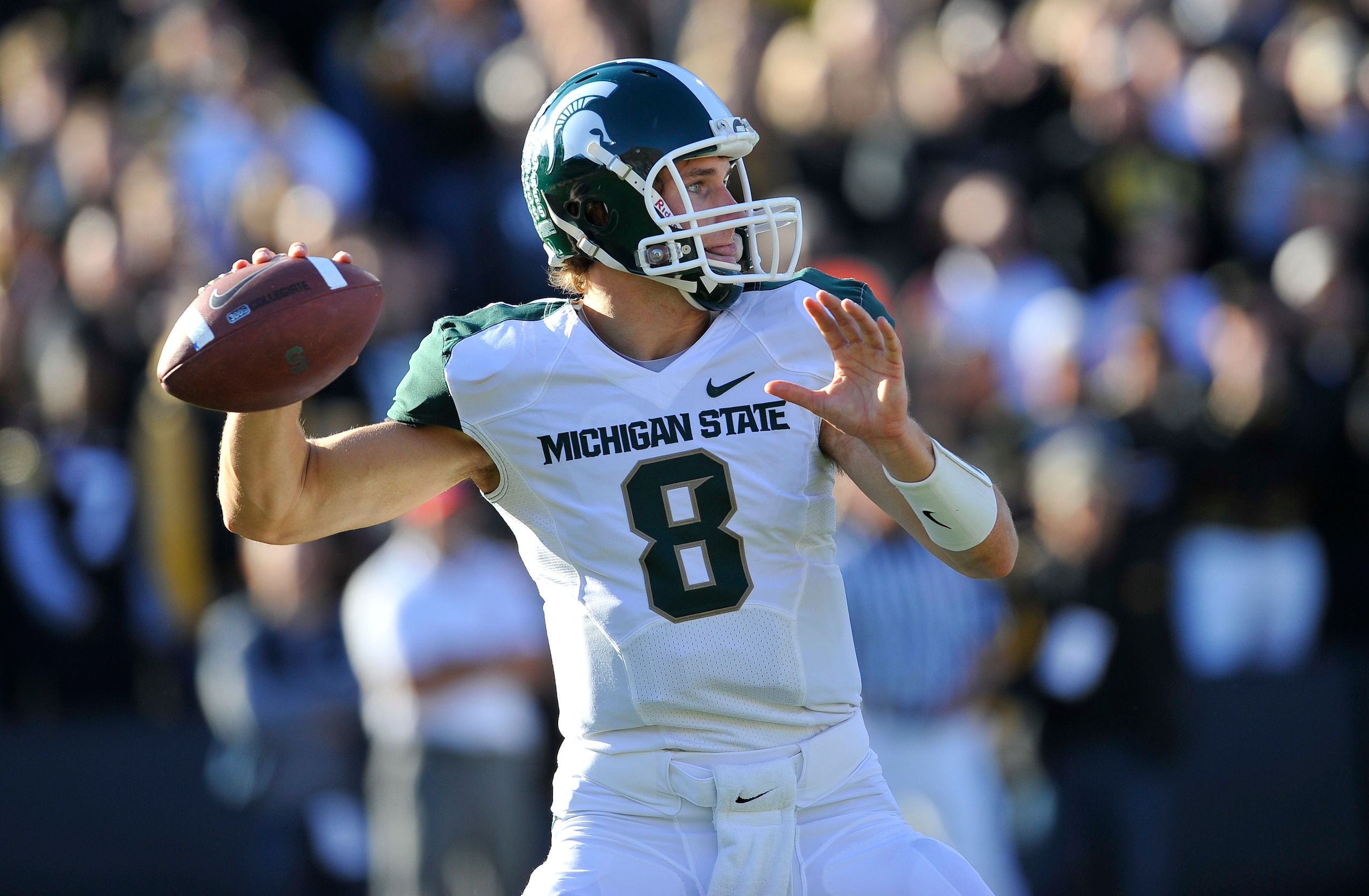 IOWA CITY, IA - OCTOBER 30- Quarterback Kirk Cousins #8 of the Michigan State Spartans looks down field for a receiver during play against the University of Iowa Hawkeyes at Kinnick Stadium on October 30, 2010 in Iowa City, Iowa. Iowa won 37-6 over Michig