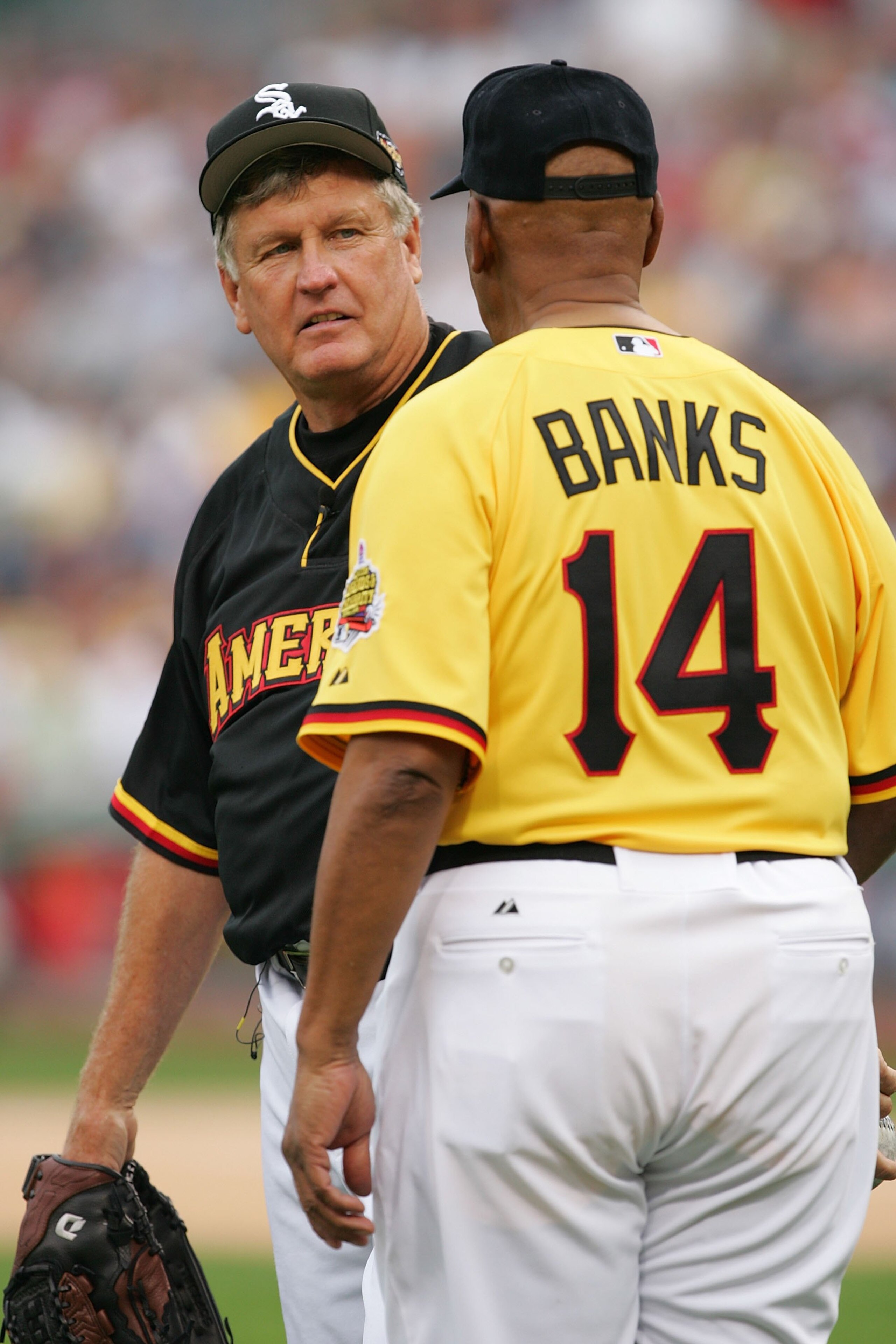 PITTSBURGH - JULY 09: Tommy John of the American Team talks with Ernie Banks of the National Team during the Taco Bell All-Star Legends & Celebrity Softball Game at PNC Park on July 9, 2006 in Pittsburgh, Pennsylvania. (Photo by Jamie Squire/Getty Image PITTSBURGH - JULY 09: Tommy John of the American Team talks with Ernie Banks of the National Team during the Taco Bell All-Star Legends & Celebrity Softball Game at PNC Park on July 9, 2006 in Pittsburgh, Pennsylvania. (Photo by Jamie Squire/Getty Image