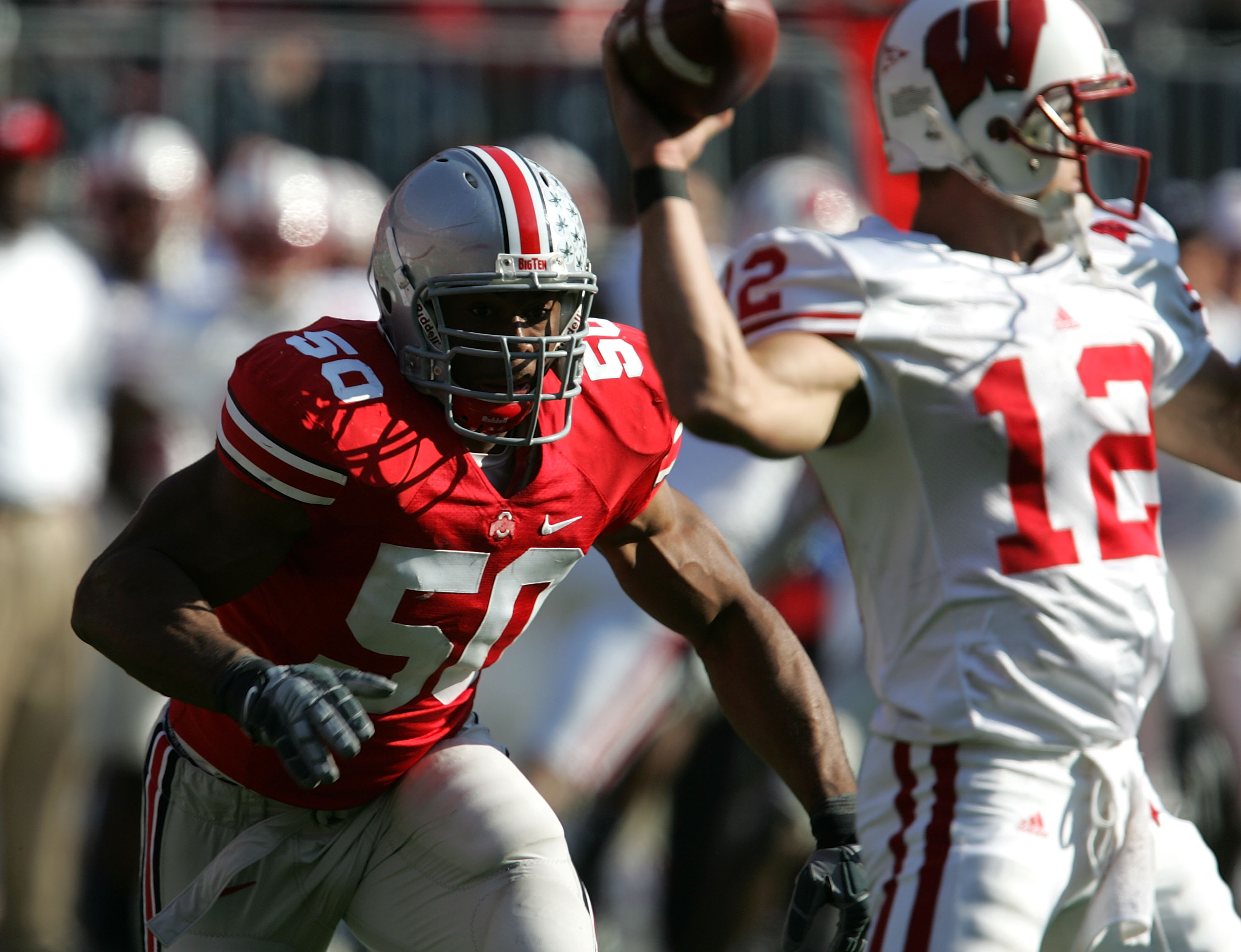 COLUMBUS, OH - NOVEMBER 03: Vernon Gholston #50 of the Ohio State Buckeyes rushes Tyler Donovan #12 of the Wisconsin Badgers on November 3, 2007 at Ohio Stadium in Columbus, Ohio. Ohio State defeated Wisconsin 38-17. (Photo by Jonathan Daniel/Getty Images